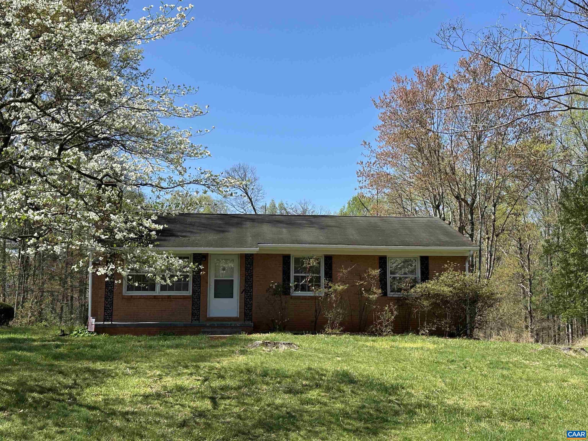 Welcome to this charming 3-bedroom, 2-bathroom house located in Albemarle County. This home features new flooring and hardwood floors throughout, as well as fresh paint to give it a modern touch. The kitchen is equipped with new appliances, perfect for preparing meals. The spacious basement provides a decorative fireplace and extra storage space, while the property boasts beautiful surroundings. Take advantage of the storage sheds for all your outdoor equipment. This house is available now and ready for you to make it your own.