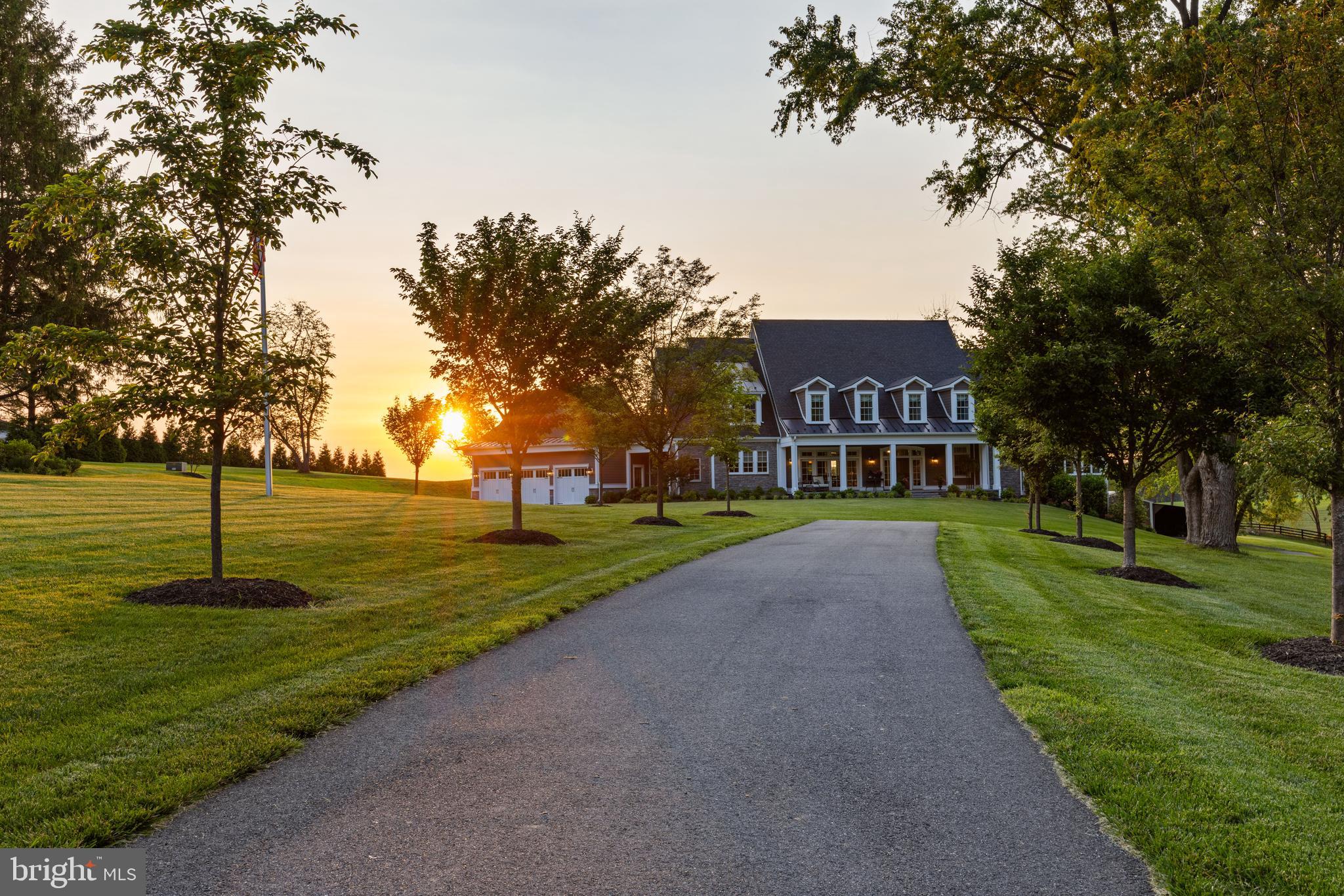 This elegant private sanctuary boasts a stunning entrance with wrought iron gates and tree adorned driveway, encompasses more than 9,800 square feet of custom designed interior living space, and offers almost 7.5 acres surrounded by agriculturally preserved land. This estate currently has 6 bedrooms, 5 full bathrooms, and 2 half bathrooms, but presents ample space to expand the home itself with an additional 3,200 sq ft of unfinished basement ready for finishing, along with the option on the property to house horses or other farm animals, possibility for a subdivision or family compound, or simply enjoy as is. Breathtaking Sunsets can be enjoyed from both the screened porch or expansive paver patio and resort style pool. Don't miss the opportunity to have your own piece of serenity.