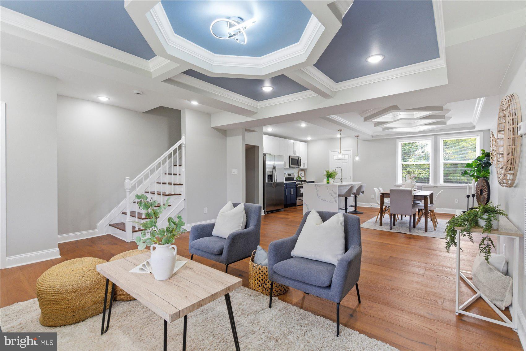 A beautiful transformation has taken place inside this 4BR/3.5BA brick Townhome located in the desirable neighborhood of Ashburton.  Park just steps from the lush green front lawn and newly planted flowers and step up to the covered front porch of your new home.  Step inside a spectacular main floor featuring an open floor plan, wide plank hardwood floors, recessed lighting, ample natural light, and custom coffered ceilings.  The main floor offers a spacious living room open to the dining room, a half bathroom, and a stunning kitchen.  The kitchen features two-tone cabinets (white uppers and cobalt lowers), stainless steel appliances, sleek quartz countertops with a subway tile backsplash, and a stainless sink set into an island. The island includes a waterfall edge, breakfast seating, and pendant lighting. The newly carpeted second floor contains two sizable secondary bedrooms, a newly remodeled and beautifully tiled full bath, and an oversized primary suite.  The primary features ample closets and a private en suite featuring a beautifully tiled walk-in shower. The lower level is finished offering a fourth bedroom with an above-grade window, a beautifully tiled full bath with a walk-in shower, a spacious recreation room, laundry, utilities, storage, and a walk-out to the fenced yard.  From the kitchen step outside to a covered cozy deck that leads down to a yard with a spacious patio and so many possibilities.  This move-in-ready home is ideal for any new homeowner and is located close to shopping, restaurants, and commuter routes.