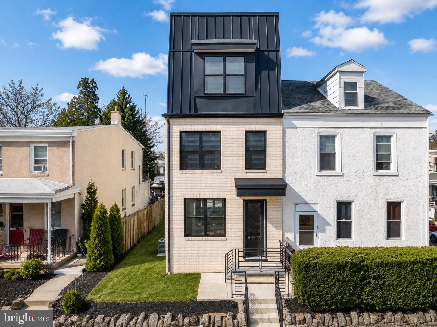Stunning New Construction in Manayunk – 4 Bedrooms | 3.5 Baths | 3-Car Parking. Welcome to this beautifully crafted new home in the heart of Manayunk, offering four bedrooms, three-and-a-half baths,  three private parking spaces, and a 752 sq ft rooftop deck. The FIRST FLOOR features a bright, open-concept layout with a spacious living room, gourmet kitchen, powder room, and family room with a gas fireplace. Sliding doors lead directly to the rear parking area for added convenience. The kitchen is thoughtfully designed with a center island, quartz countertops, and stainless steel appliances—perfect for both everyday living and entertaining. The SECOND FLOOR is home to an impressive primary suite complete with a generous bedroom, separate his-and-hers closets, and a luxurious en-suite bath featuring a walk-in shower with multiple shower heads, a deep soaking jetted tub, and a double vanity. The THIRD FLOOR offers two additional bedrooms, a full hall bath with double vanity and walk-in shower, plus a conveniently located laundry area. Enjoy sweeping views from the ROOFTOP DECK, an ideal space for relaxing or hosting gatherings. The LOWER LEVEL provides exceptional bonus space, including a steam room, sitting/flex room, fourth bedroom, and a full bath with walk-in shower—perfect for guests or extended living. Additional highlights include: Two brand-new gas HVAC systems, Solid hickory hardwood flooring throughout,  Luxury vinyl plank flooring in the lower level, Three private parking spaces. Ideally situated in Manayunk, this home offers easy access to the Tow Path and Schuylkill River Trail, along with nearby restaurants, shopping, and public transportation. A rare opportunity to own a thoughtfully designed home in one of Philadelphia’s most vibrant neighborhoods. Best Feature is that the home offers a TEN TEAR TAX ABATEMENT.
