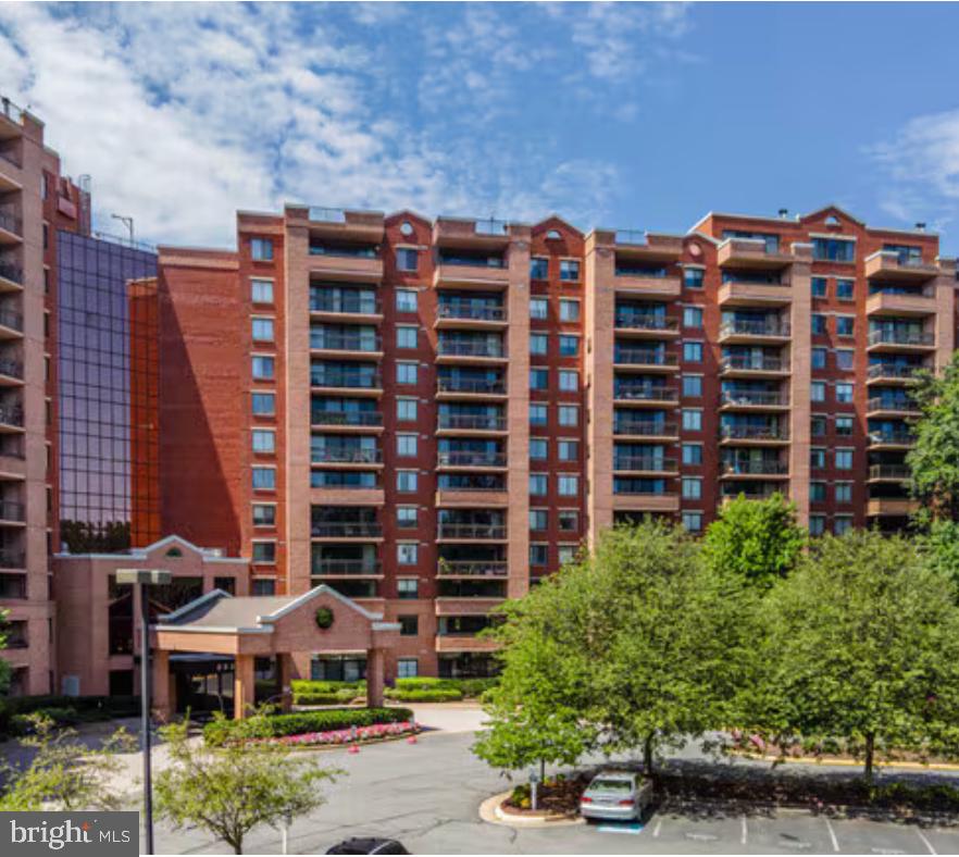 Welcome to this meticulously maintained 2-bedroom, 2-bath condo in the sought-after Renaissance at Tysons. Beautiful real wood floors flow throughout the thoughtfully updated interior. The renovated kitchen showcases modern cabinets, updated appliances, and stylish finishes designed for both everyday living and entertaining. Recent improvements include new flooring and a sliding glass door that opens to a private balcony with a stunning view—perfect for morning coffee or evening relaxation. A stacked washer and dryer in the unit adds everyday convenience. One separate storage unit conveys. Assigned parking spot! Residents enjoy resort-style amenities including indoor/outdoor tennis and a pool enclosed with seasonal bubbles for year-round use, plus a fitness center and scenic fitness trail. Ideally located within walking distance to the Metro with a free shuttle, and just minutes from Tysons Corner, the Beltway, and I-66.