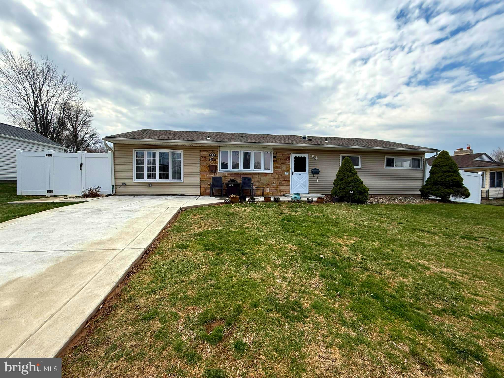 Practically a new house! One level living in Levittown with a newer roof (2021),  updated kitchen with tons of cabinets, updated baths, fresh paint and updated flooring, 2 new sliders to fenced in yard with built in blinds, keyless entry, lots of extras! There is a 3 season room, a laundry room, a workshop and a bonus family room to give you a lot of options how you use the space. Main bedroom has a full bath and sliding doors to the yard.  This house is move-in ready and ready for you to make it your own. Available immediately!