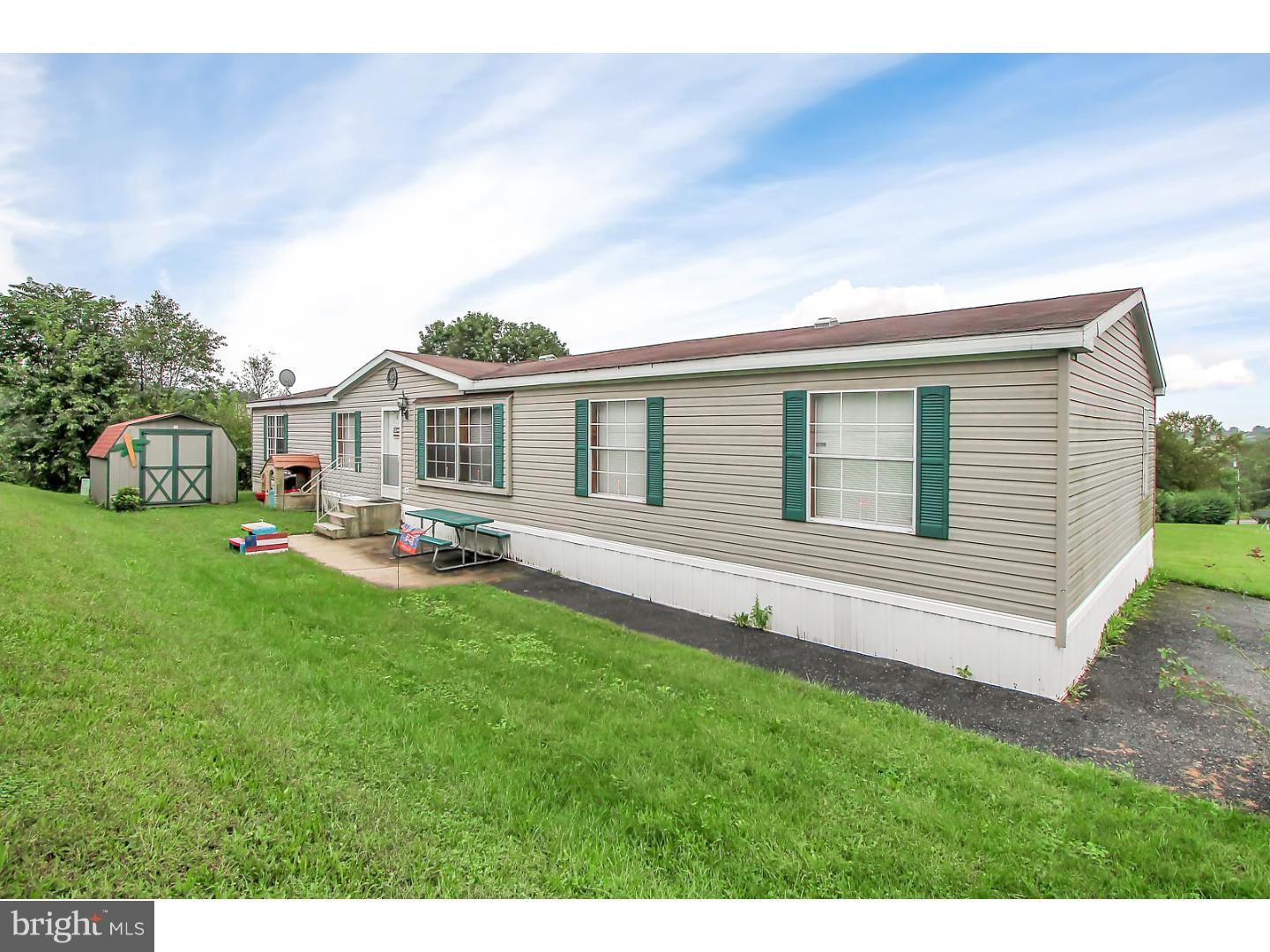 This beautiful and spacious open concept ranch home is a must see. With over 2100 square feet of living space. Offering  4 bedrooms,  2.5 bathrooms, and a main floor laundry room. Plenty of room to spread out in the large living room with vaulted ceilings. The kitchen offers lots of cabinet and countertop  space and well as an island. Cozy up on the cool nights aside your fireplace. The master bedroom features a large on suite bath with a soaking tub and stand up shower as well as an oversized walk in closet. All of the other bedrooms are also very spacious in size. Fresh paint and newer flooring throughout complete this beautiful home. Come see for your self before its gone. Lot rent - $340. month fee.