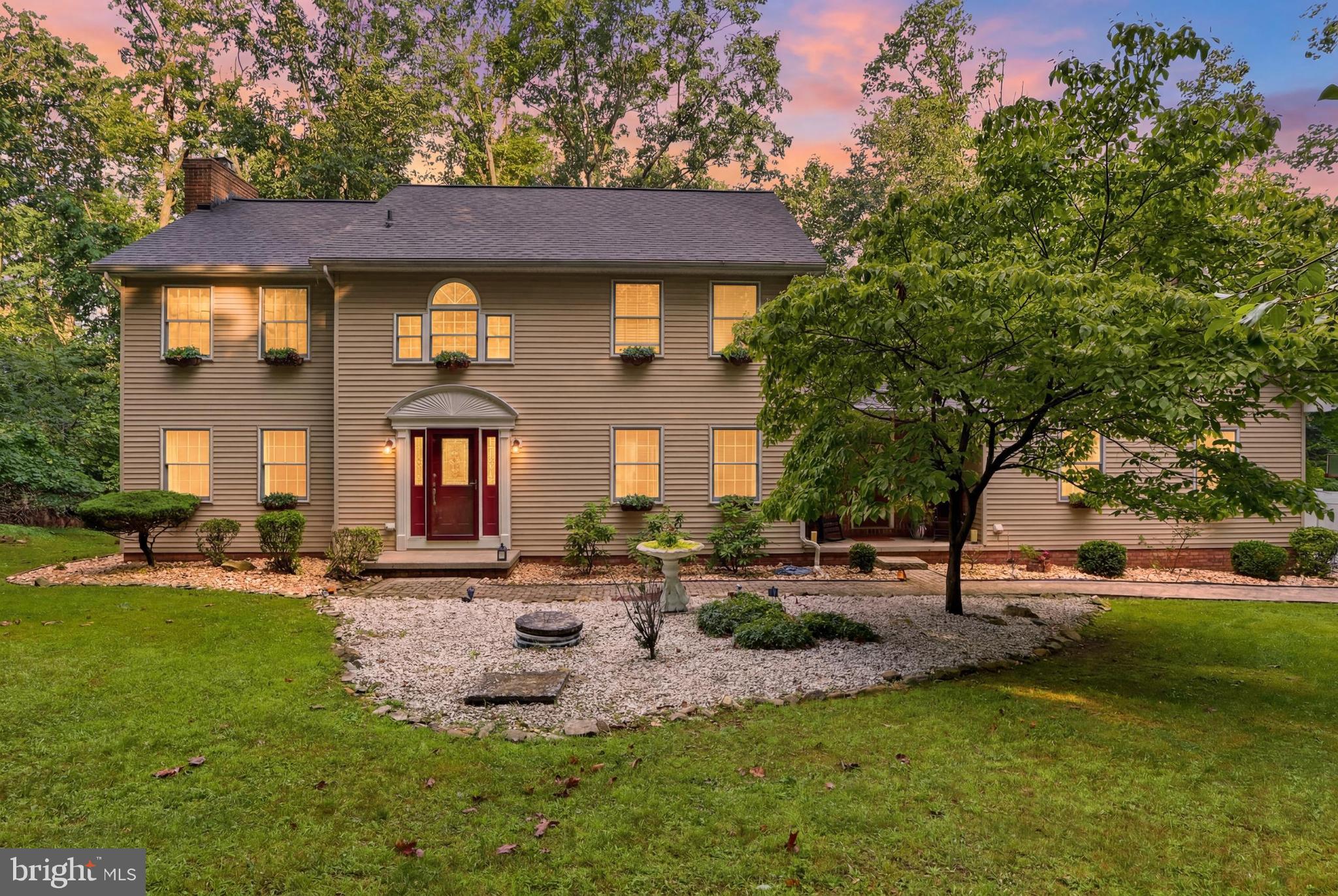 This is more then a house--it's where life's best moments begin.  
Step inside to find a welcoming first floor bedroom with a full bath--perfect for guests, inlaws, or a private retreat.  The convenient fir-floor laundry and mudroom keep life effortless, while the warm glow of the wood burning fireplace invites you to slow down and make memories
Beyond the foyer, the heart unfolds,  A generous living room with recessed lighting sets the stage for cozy nights and lively gatherings.  The open flow leads you to a stunning kitchen--complete with abundant cabinetry, granite countertops, a large pantry, down draft oven/range, and a breakfast nook where mornings start with sunshine and coffee.
From casual family dinners to holiday celebrations, the formal dining and living area is ready to host every occasion.  In the spacious family room, wood beams overhead add character and charm, creating a space where everyone feels at home.
This home is made for living, loving, and making memories,  Come experience it foryourself
Just off the mudroom, you'll discover a private staircase leading to a bonus room above the garage.  Complete with a full bath, kitchenette, and its own mini-split heating and cooling system, this versatile space is ideal as a private guest area or adult children.  It can even be used as a craft area, art studio, or office.  Offering comfort and independence, its a space that adapts to your family's changing needs.
Upstairs, you will find 4 spacious bedrooms, all featuring durable luxary vinyl plank flooring and ceiling fans.  The expansive primary suite offers a peaceful retreat, complete with a private ensuite bath featuring a doule vanity and tiled tub shower combo.  There is also a walk in closet.  Three additional bedrooms provide plenty of space for family, guests, or a home office.
Last but not least, the finsihed basement adds more versatile living space.  Whether your entertaining friends or simply unwinding after a long day, you will appreciate the built in wet bar and flexibility this space provides.  An abundance of storage space ensures you will have room for everything while keeping your home organized.
Step outside and experience the beauty and privacy of 2.3 wooded acres, offering the perfect backdrop for everyday living and outdoor entertaining.  Spend your evenings relaxing on the spacious deck, gathering around the fire pit under the stars, or enjoying the charming paver patio.  A small fenced area provides a safe place for children or pets to play, while the surrounding property offers plenty of room to explore and create memories.
One last feature is the oversized 3 car garage and plenty of parking in the driveway.
A home like this is all about the memories, come see for yourself