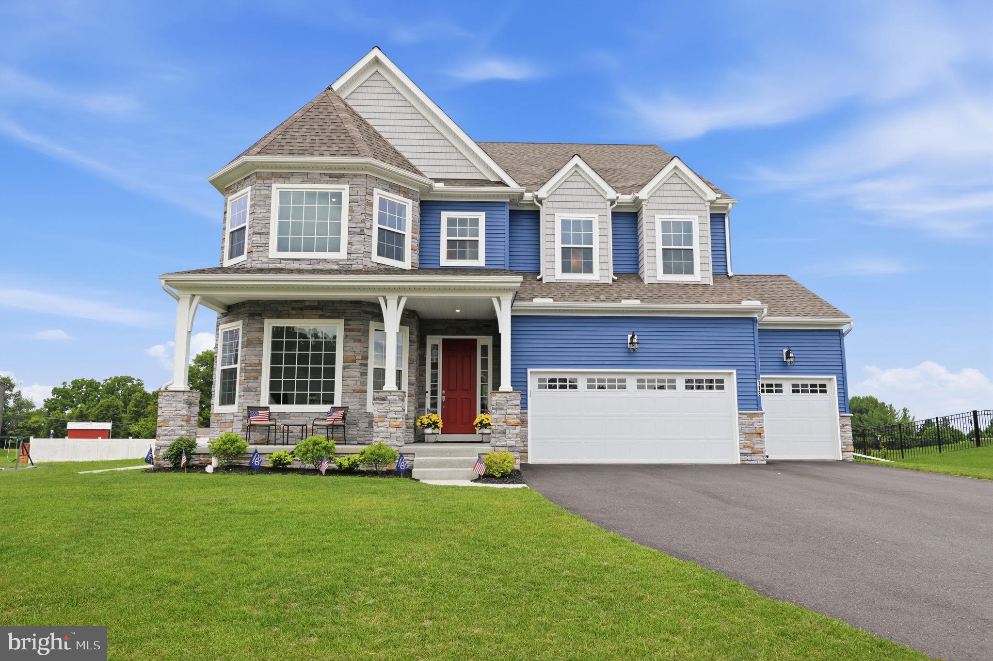 Welcome to 113 Cameron Lane in the Sanctuary at Lititz Grove, where Custom Design meets the beauty of Lancaster County. Built by Keystone Custom Homes, this exceptional one-year-old Covington Heritage model offers luxury living just minutes from downtown Lititz, shopping, dining, and everyday conveniences. This thoughtfully upgraded 4-bedroom, 3.5-bath home features expanded square footage, abundant storage, and premium finishes throughout. A custom 8-foot entry door with dual sidelights welcomes you into a spacious foyer highlighted by 10-foot ceilings on the main level, 9-foot ceilings upstairs, oversized windows, 8-foot doors throughout the first floor, solid-core interior doors throughout the home, upgraded lighting, and EVP flooring throughout the living areas. Soft upgraded carpeting adds comfort in all bedrooms and the finished basement recreation area. A private office with double glass doors and a walkout bay featuring an oversized picture window creates an ideal work-from-home space. The formal dining room is perfect for entertaining, while the elegant staircase with stained wood treads and black metal balusters serves as a striking focal point. The heart of the home is the beautifully appointed kitchen, featuring soft-gray cabinetry with soft-close doors and dovetail soft-close drawers, quartz countertops, tiled backsplash, an expanded island with seating, upgraded stainless steel appliances, and an oversized pantry. The kitchen flows seamlessly into the enlarged great room, with abundant natural light, featuring a gas fireplace with black marble surround and mantel. A bumped-out breakfast nook showcases a dramatic picture window and access to the rear yard, creating a bright and inviting space for everyday living and entertaining. Adjacent to the kitchen, the mudroom offers a large walk-in closet and access to the 3-car garage. The finished lower level provides exceptional entertaining space, including a custom café-style wet bar with navy cabinetry, full-size refrigerator, microwave, sink, and seating area. The expansive recreation area is ideal for game days, movie nights, or gatherings, while the unfinished section offers excellent storage, an egress window, and mechanical space. A battery-backup sump pump provides additional peace of mind. Upstairs, a versatile loft offers flexible living space. Bedroom #2 features a private en-suite bath, while Bedrooms #3 and #4 are enlarged and include walk-in closets. The hall bath features a double vanity and separate tub/toilet area. Consistent finishes throughout the home include brushed nickel faucets, lighting, hardware, and white marble vanity tops in the powder room and secondary baths. The luxurious primary suite is a private retreat with two oversized walk-in closets and a spa-inspired Serenity bath. Highlights include an expanded tiled shower with dual showerheads, river-rock tiled shower floor, frameless glass enclosure, dual quartz vanities, upgraded soft-gray cabinetry, a separate water closet, and a relaxing vessel tub beneath two corner windows. Completing the second floor is a fully appointed laundry room featuring a laundry center with upgraded sink, cabinets, washer and dryer, and sound-insulated walls designed to help minimize noise transfer. Additional upgrades include enhanced stone and siding on the front elevation, an extended front porch, upgraded garage doors with MyQ openers, EV charger pre-wiring, additional electrical outlets, motion-sensing exterior lighting, and extra hose bib connections. The home's oversized windows—including impressive picture windows in the office, breakfast nook, and front bedroom—fill the interior with natural light, while the 6-foot windows throughout the main level further enhance the home's bright, open feel. The builder's one-year punch list has been completed, making this stunning home truly move-in ready. Don't miss the opportunity to own this exceptional residence in one of Lititz's most desirable communities.