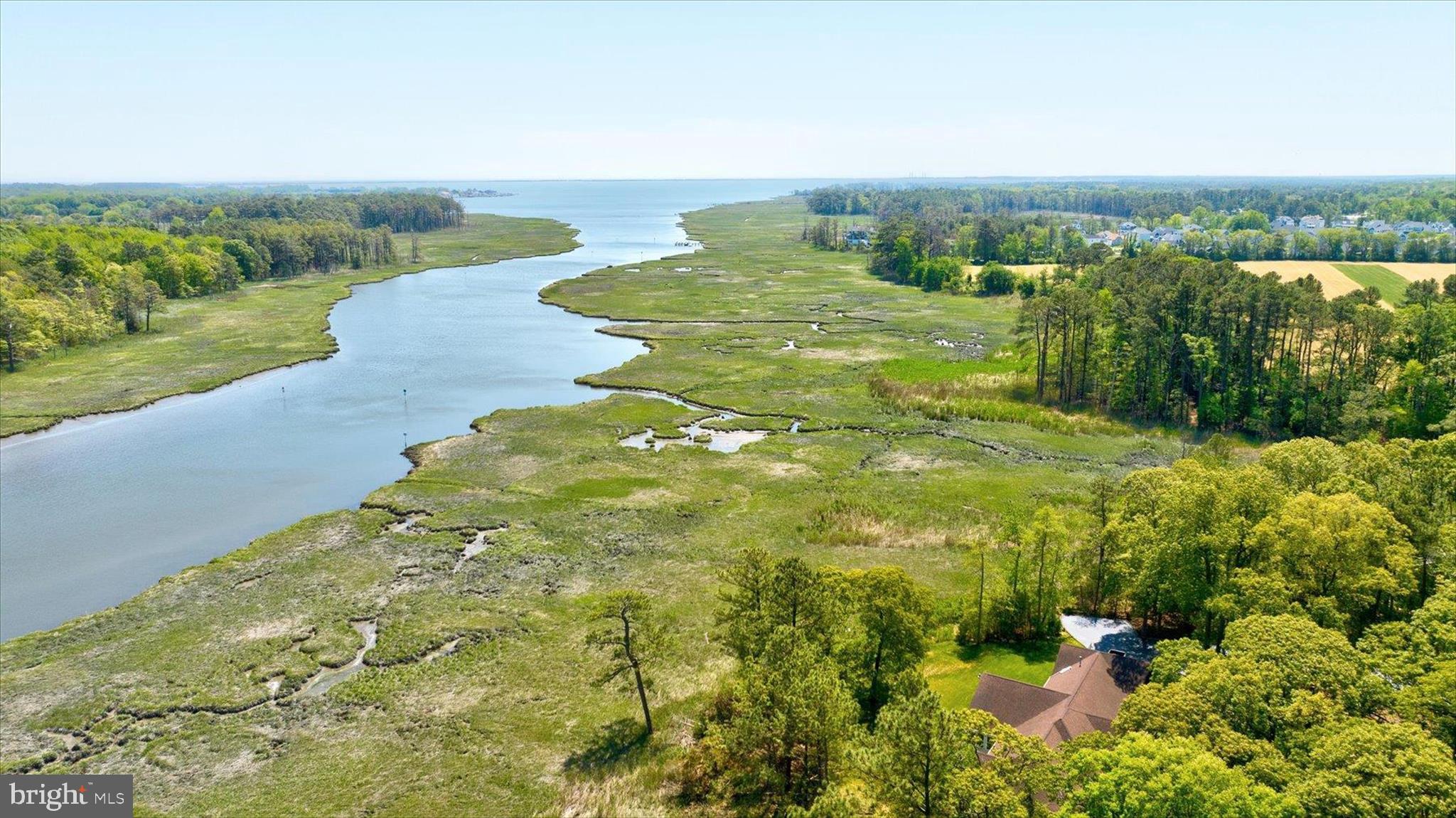 Welcome to 34 Love Creek Drive, 4.6 +/- waterfront acreage, centrally located and a short drive to downtown Lewes, the Cape May Lewes Ferry, and Rehoboth Beach Boardwalk. Reside, renovate, or expand to your liking. 

The existing single level, 3 BD, 2 1/2 BA, 2 car garage coastal residence is serviced by water, sewer, and optic cable, situated at the end of a private paved lane. Tucked away behind a stone wall and grove of mature trees, just off Rt. 1 and 24, at the end of the Love Creek Woods community. 

New Irrigation and Well keep the landscaped grounds lush and for easy maintenance. Enjoy the sweeping panoramic Love Creek waterfront views, teaming wildlife and prolific birds from the current sunroom, screened porch and residence. 

Self-managed HOA, with a low fee, covers a Clubhouse and Pool, available for private gatherings. 

Create one's own secluded oasis on this special rare Waterfront Opportunity Acreage. 

No builder Tie-in, nor required timeline. Call for more information and details on this rare opportunity and make this property your own!