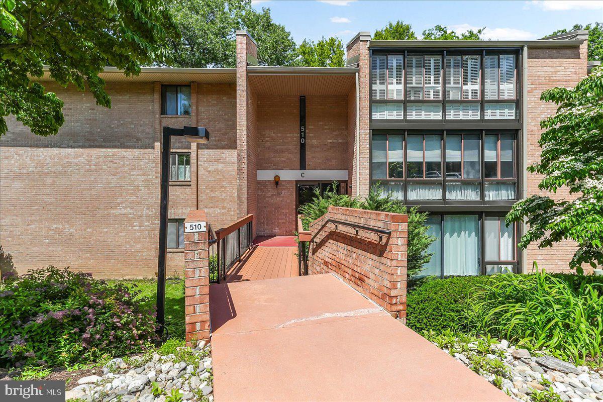 This is a unique opportunity to own a one -bedroom condo in Hickory Hill Condominiums in Media Borough, which was named one of 50 best places to live in the US by the prestigious publication, Money Magazine.           This pristine, 775 sq.ft.one-bedroom condo is accessible through a secure building door that leads you to an art-filled communal hallway.  The mid-century modern Hickory Hill architectural style is reflected inside the unit with newer lighting fixtures and newer neutral colored wall to wall carpeting throughout. There is a private entry area inside the unit with a large coat closet and Moroccan screens that open into the dining area, which is connected to the spacious east-facing living room with loads of natural light. Sliding doors lead to the sun room, which can be used as an office, den, workout/yoga room, studio (whatever you can visualize), and is lined with exposed brick and Plantation Shutters.  The utility closet is connected here with additional storage (5' x7').    The cozy & bright galley kitchen features classic cream cabinetry, offering a clean & timeless look, along with white appliances and plenty of counter space for meal prep.  The roomy bedroom has sliding windows with Plantation Shutters and two large closets;  the bathroom has a tiled bathtub/shower combo, tiled flooring a modern vanity.  The hallway hosts a stacked washer/dryer,  a linen closet/pantry and storage closet with upgraded electrical box  and newer hot water heater (2025)
The condo features central a/c, forced hot air electric heat; water is included. Owner pays electric, internet & cable. No pets, No smoking. No owner / investors. 
This beautifully maintained  complex has reserved parking and additional on site/off street parking for guests, plus space to wash your car on the premises.     This coveted condo unit is a sanctuary in an idyllic woodland setting with mature trees, beautiful landscaping, wildlife and a stream; You can enjoy all of this , but also have the option of going into town for all it offers. It is less than a half mile to State Street, the center of Media, "Everybody's Hometown", and the county seat of Delco, with its acclaimed theater, restaurants, shops and community events.   Media's events, activities and nearby amenities make this condo a special place to live.  The benefits include, Dining Under the Stars; New Year's Eve Ball Drop; America's Music Festival Series; nearby Rose Tree Park with Summer Festival Music Series; Linvilla Orchards; Tyler Arboretum; and Ridley Creek State Park, with it's excellent hiking, biking, and walking trails.    Conveniently located to State Street Trolley, Septa Rails, PHL Airport, Phila, DE, NJ, NYC and all major routes, including I95 and 476 (Blue Rt)