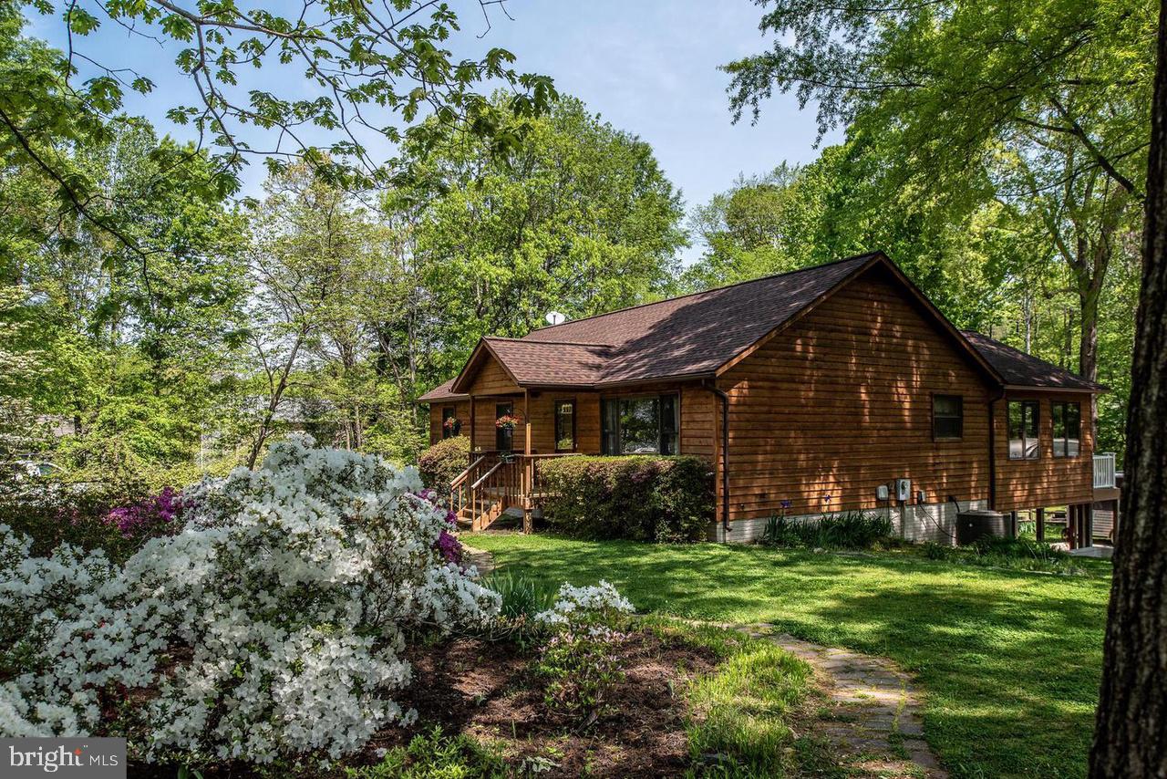 Tucked away on 1.12 acres only a few short minutes to TBS gate of Quantico.  Open floor plan has large eat-in kitchen, with family room and dining room and large cozy rear sunroom opening on the the back deck.  Finished walk-out basement has 2 additional bedrooms (NTC) and living room with luxury vinyl flooring. Lots of storage and an oversized 1 car garage. Outside spend your warm summer days splashing around in the above ground pool or grilling out on the two tier deck. The fenced in rear yard has two storage buildings.  You won't want to miss this lovely home. Pets considered on a case by case basis.