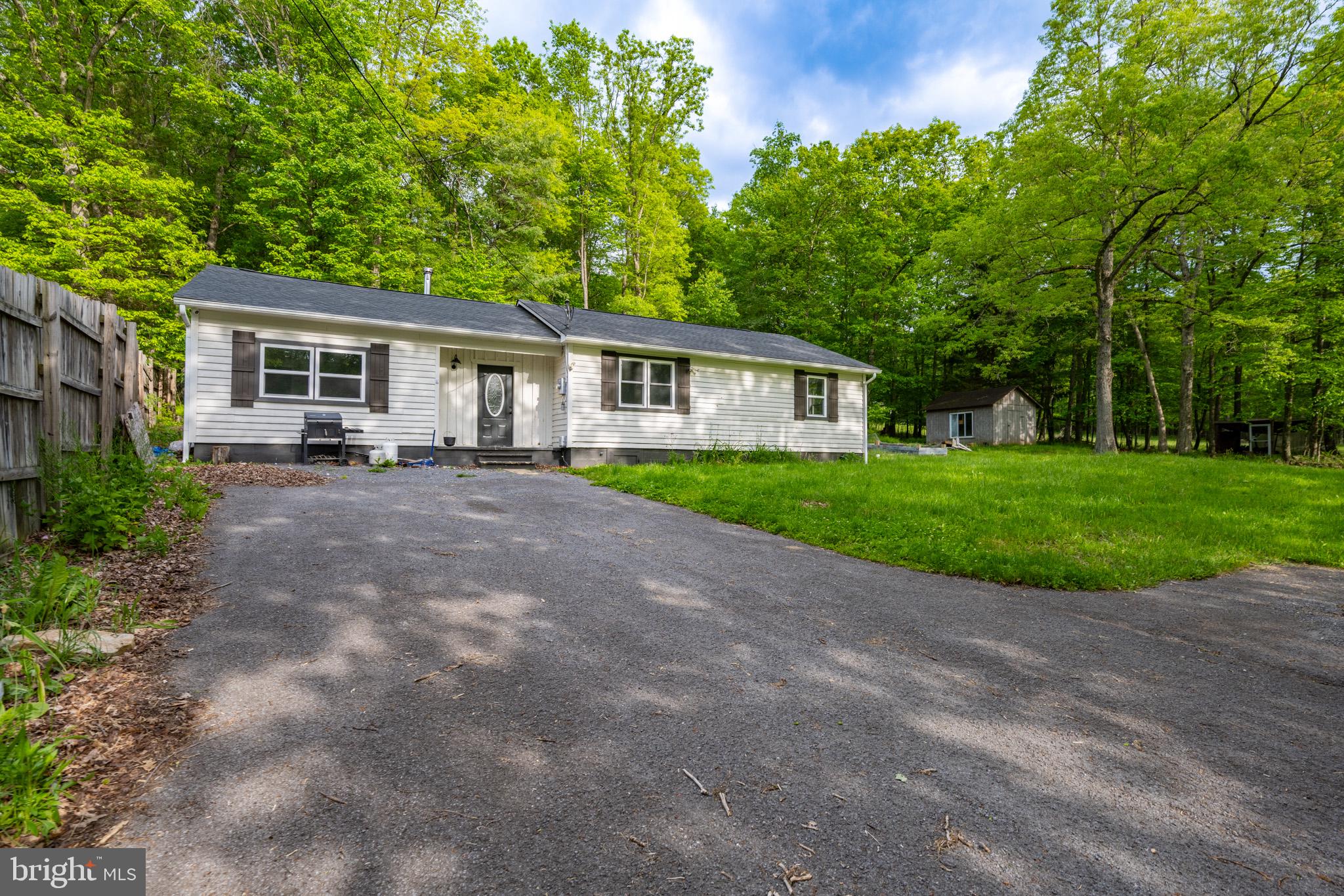 This charming 3-bedroom, 1-bathroom ranch-style home in the desirable Oakland Sang Run Rd area near the Youghiogheny River offers a blend of modern upgrades and classic appeal. Recently renovated in 2022, the interior features an open floor plan with luxury vinyl tile flooring, built-ins, and a gourmet kitchen equipped with stainless steel appliances and upgraded countertops. Enjoy the convenience of main floor laundry and double-pane windows for energy efficiency. Set on a generous 4.88-acre lot, the exterior includes an outbuilding and a wood/metal shed, perfect for storage or hobbies. The property provides ample driveway parking and a serene outdoor space for relaxation. Located in a vibrant community, residents benefit from nearby parks, excellent schools, and convenient public services. This home is ideal for those seeking a peaceful retreat with easy access to local amenities. Don't miss the opportunity to make this property your own!