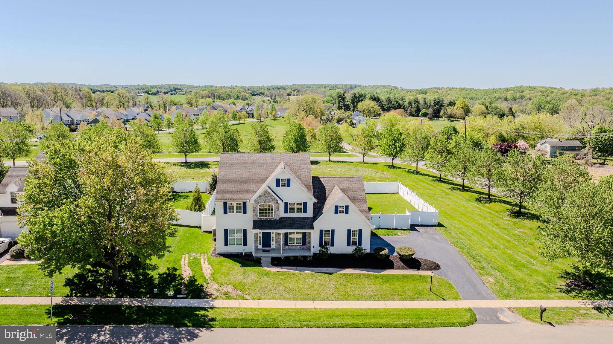 Welcome to 131 Martha’s Way, in West Grove’s highly sought-after community of Lamborn Hunt.  This home has everything!  Highlights include a main floor office, open living spaces, renovated kitchen & baths, a beautifully finished basement with gas fireplace, and a dream backyard oasis with in-ground pool and fenced yard. It doesn’t get any better than this! Step inside to a bright two-story foyer and hardwood floors leading to the professional office/den on one side and the open living room & dining room on the other; ideal for family gatherings. Flow into the open main living space joining the kitchen & family room, with recessed lighting and a view outdoors from each space. This kitchen features white cabinetry with undermount lighting, granite countertops, stainless steel appliances, oversized center island with seating, and the adjoining family room with vaulted ceiling and plenty of space to relax.   From the main living space, step outside to the ultimate outdoor space starting with the expansive stone patio with built-in awning, a fabulous in-ground pool, two pergolas, and a completely fenced yard, offering total privacy.  This is the perfect place for making memories with family and friends, just in time for spring and summer!   Back inside and completing the main level is an updated powder room for guests and a laundry/mudroom located off the garage. Upstairs, you will find all 4 bedrooms and two baths, including the beautifully updated primary bath with granite double vanity and corner tub & shower, and an additional hall bathroom. The lower level of this home has been beautifully finished and offers space for your movie room, game room, rec room, office, gym, or whatever your needs require.  With a gas fireplace, full bath, and several separated spaces, the possibilities are endless. Situated on a lovely corner property within the Avon Grove School District.  Be sure to schedule an appointment today!