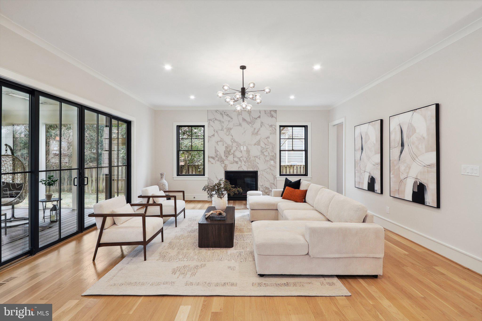 Prepare to be amazed by this exceptional, brand-new Craftsman home at 2029 N Kenmore St, nestled on a generous 9,600 sq. ft. lot. Every inch of this 5,757 sq. ft. residence has been meticulously crafted with high-end finishes and luxurious materials, blending timeless elegance with modern functionality. No detail has been spared, with striking Hansgrohe fixtures, designer lighting, and custom-selected tile in all five full bathrooms and two powder rooms.

Located in the coveted, peaceful Cherrydale neighborhood and just minutes from downtown DC and I-66, this stunning custom home offers exceptional design and flawless craftsmanship. Spanning three levels, it features 5 spacious bedrooms, 5 luxurious bathrooms, 2 powder rooms, an oversized double-car garage with independent doors and a car charging station, and ample storage space. The main floor presents a grand foyer, an elegant office, a formal dining room, a wet bar with built-in cabinetry, and a custom-designed kitchen equipped with Wynnbrooke cabinetry, Thermador appliances, a walk-in pantry, and exquisite countertops.

Upon entering, you'll be greeted by open, inviting spaces where sleek design meets livable luxury. The expansive living room, complete with a gas fireplace, seamlessly flows into a screened-in porch with dual electric heaters—perfect for year-round enjoyment. Floor-to-ceiling Anderson 400 windows fill the home with natural light, creating a bright, airy atmosphere throughout.

The second level offers spacious ensuite bedrooms, including a serene owner’s retreat with expansive walk-in closets and a spa-inspired bath. The walk-out lower level features a recreation room, gym, mudroom, wine bar with built-in cabinetry, and a guest suite, offering endless opportunities for relaxation and entertainment.

With solid oak flooring throughout, cutting-edge technology, an oversized two-car garage, and a beautifully landscaped, fenced yard, this home exemplifies luxury living. Designed with meticulous attention to detail and thoughtful craftsmanship, 2029 N Kenmore St represents the perfect blend of modern luxury and timeless elegance.