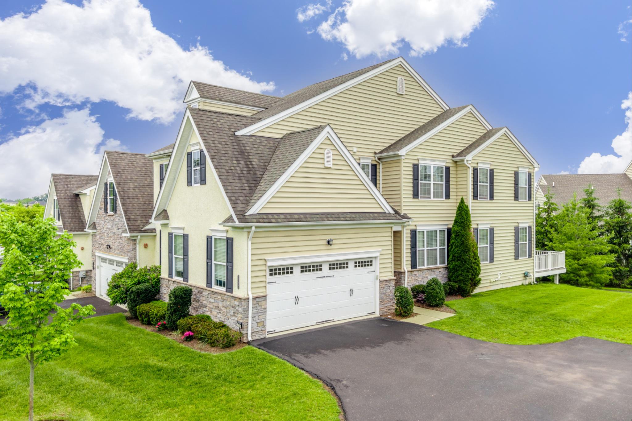 Welcome to the gated community of Thorndale within the highly regarded North Penn School District. This beautifully appointed end-unit townhome offers over 3000sqft of combined living space including  3 bedrooms, 3.5 baths, a two-car garage, and thoughtfully designed modern living space that balances openness with architectural definition.

Rich espresso-toned hand-scraped hardwood flooring flows throughout the main level, creating warmth and sophistication from the moment you enter the home. The kitchen is both stylish and functional, featuring slate appliances, granite countertops, a center island with seating, and an extended breakfast area surrounded by windows that fill the space with natural light. Directly leading to the Trex deck, you will find the perfect area for grilling, entertaining, or simply relaxing with the privacy of mature landscaping and no homes directly behind you. 

As an end unit, the home benefits from an abundance of sunlight that enhances the spacious feel throughout. The adjoining living area has a gas fireplace, creating a cozy setting for cooler nights. A powder room and a private study, ideal for a home office, playroom, or flex space, complete the main level. Custom wooden blinds throughout the home add warmth, elegance, and timeless style while providing both privacy and natural light control.

Upstairs, the spacious owner’s suite offers a calming neutral palette, two walk-in closets, and a beautifully renovated ensuite bath featuring a glass-enclosed spa-style shower. A dedicated vanity area was designed for everyday convenience, nothing has been overlooked in your very own oasis. Two additional bedrooms share a full hall bath, while the second-floor laundry room adds practicality to daily living.

The recently finished lower level expands the home’s versatility adding an additional 775sqft of living space, with durable white oak luxury vinyl flooring and a bright, contemporary aesthetic. This level provides exceptional flex space with Wifi controlled lights and Bluetooth surround sound audio- perfect for game days, movie nights, guests, fitness, or extended living for family or friends. A private fourth bedroom or guest suite is perfect for multi-generational living.  Storage space is unparalleled in this home for all your prized possessions. 

Enjoy low-maintenance living with the HOA handling all landscaping and complete snow removal throughout the community.
Tree lined streets, walking paths and close proximity to shopping, dining, and  parks, create an exceptional location.  Refined finishes, and versatile living spaces combined create a home designed for both comfort and entertaining.