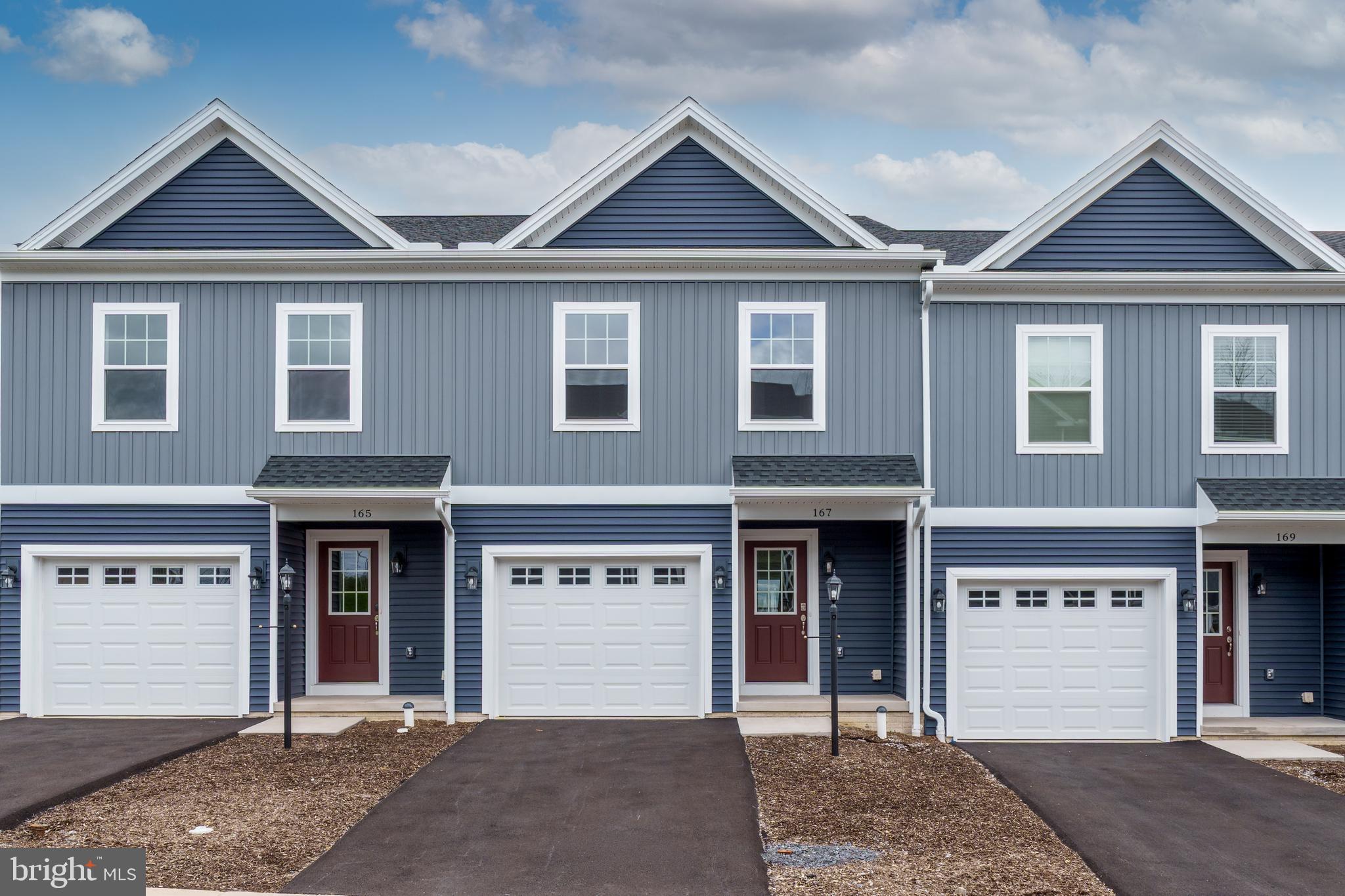 Steeplechase offers a suburban setting with walking paths and landscaped common areas, located 5 minutes from I-99, near Historic Bellefonte, and 10–15 minutes from Penn State University. 

The Steadfield interior-unit plan features a kitchen with quartz countertops, gray cabinetry, a center island with overhang, and Whirlpool appliances, including a smooth top range, microwave, and dishwasher. Wafer LED lighting is included throughout. A 10' x 10' pressure-treated deck provides outdoor space. The owner’s suite includes a private bath, and second-floor laundry adds convenience. The home also includes an unfinished walk-out basement with a full window on the rear wall, a garage door opener, gas heat, and central air. 

Contact us for more details on this home.