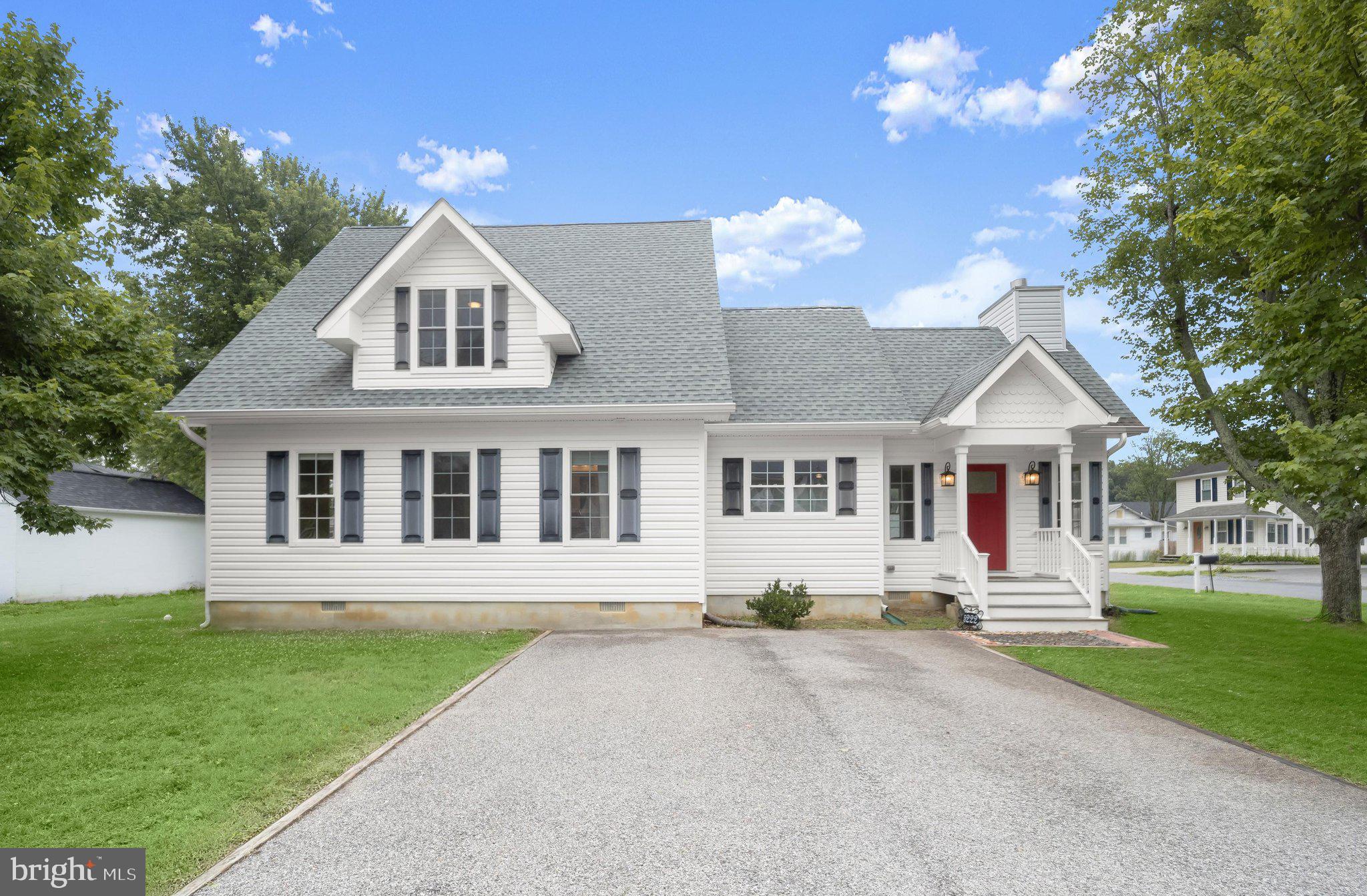 Set on a large double corner lot in the waterfront community of Cedarhurst, this four-bedroom, three full bath Cape Cod offers a flexible layout and thoughtful updates throughout in a setting where everyday can feel like a vacation. Just down the street from the water, the home blends relaxed coastal living with resort-style community amenities along the Chesapeake Bay in Shady Side.
An open floor plan defines the main level, where vaulted ceilings connect the living room, dining area, and kitchen. Hardwood flooring runs through much of the home, while the living room is wrapped in windows and centered by a cozy gas fireplace. The kitchen features bright white cabinetry, granite countertops, a central island, and stainless steel appliances.
A main-level primary bedroom provides convenience and includes an en-suite bath with beadboard trim and a double sink vanity. Two additional bedrooms and a full hall bath complete this level, along with a dedicated laundry room.
Upstairs, the current owners have created a second primary suite option. This space includes a luxurious en-suite bath with a floor-to-ceiling tiled shower featuring a river rock floor and frameless glass door, along with a modern freestanding soaking tub. A walk-in closet with built-ins adds function and storage. The upper level also includes a landing area and two utility rooms, one of which features a recently added water softener system.
Outdoor living is enhanced by a deck just off the living room overlooking the side yards, along with a storage shed for additional space. The interior has also been freshly painted by the current owners, giving the home a clean and updated feel.
Cedarhurst on the Bay is a true waterfront community on the western shore of the Chesapeake Bay, offering residents access to a community harbor with over 60 boat slips, a boat ramp, fishing and crabbing pier, sandy beach, and expansive waterfront common areas. Additional amenities include picnic areas, playgrounds, green space, and a community house used for neighborhood events. Marina services accommodate both power and sailboats, with slips available for reservation. Residents enjoy boating, kayaking, swimming, and wide-open Chesapeake Bay views just moments from home.