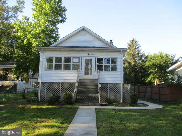Must see the inside to see how big this home really is !! Enclosed front porch, huge rear yard & patio area in rear. Main level has hardwood floors except kitchen. 3 main level bedrooms & full bath. Kitchen has walk in pantry with lots of storage space & window. walk up stairs to attic for added storage. Full basement would make a nice rec room with walk out stairs to back yard. Agents view Docs.