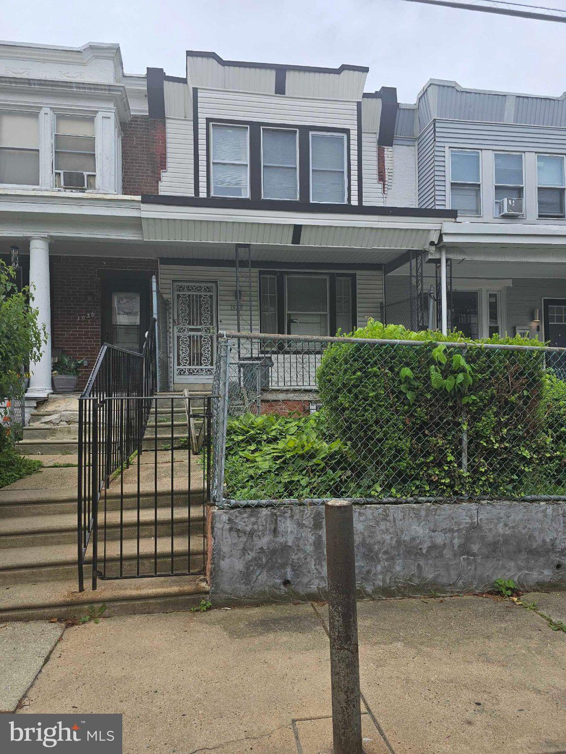 Spacious 2-Level Rowhome Offering Great Potential and Convenient Location! Featuring a Welcoming Covered Front Porch, Fenced Front Yard, and Private Backyard Perfect for Outdoor Enjoyment, Gardening, or Entertaining. Interior Offers a Functional Multi-Level Layout Ready for your Personal Updates and Cosmetic Improvements to Truly Make it Shine. Excellent Opportunity for Homeowners or Investors Looking to Add Value. Conveniently Located Close to Schools, Shopping, Dining, and Major Commuter Routes for Easy Everyday Living and Accessibility!  Sold As-Is.