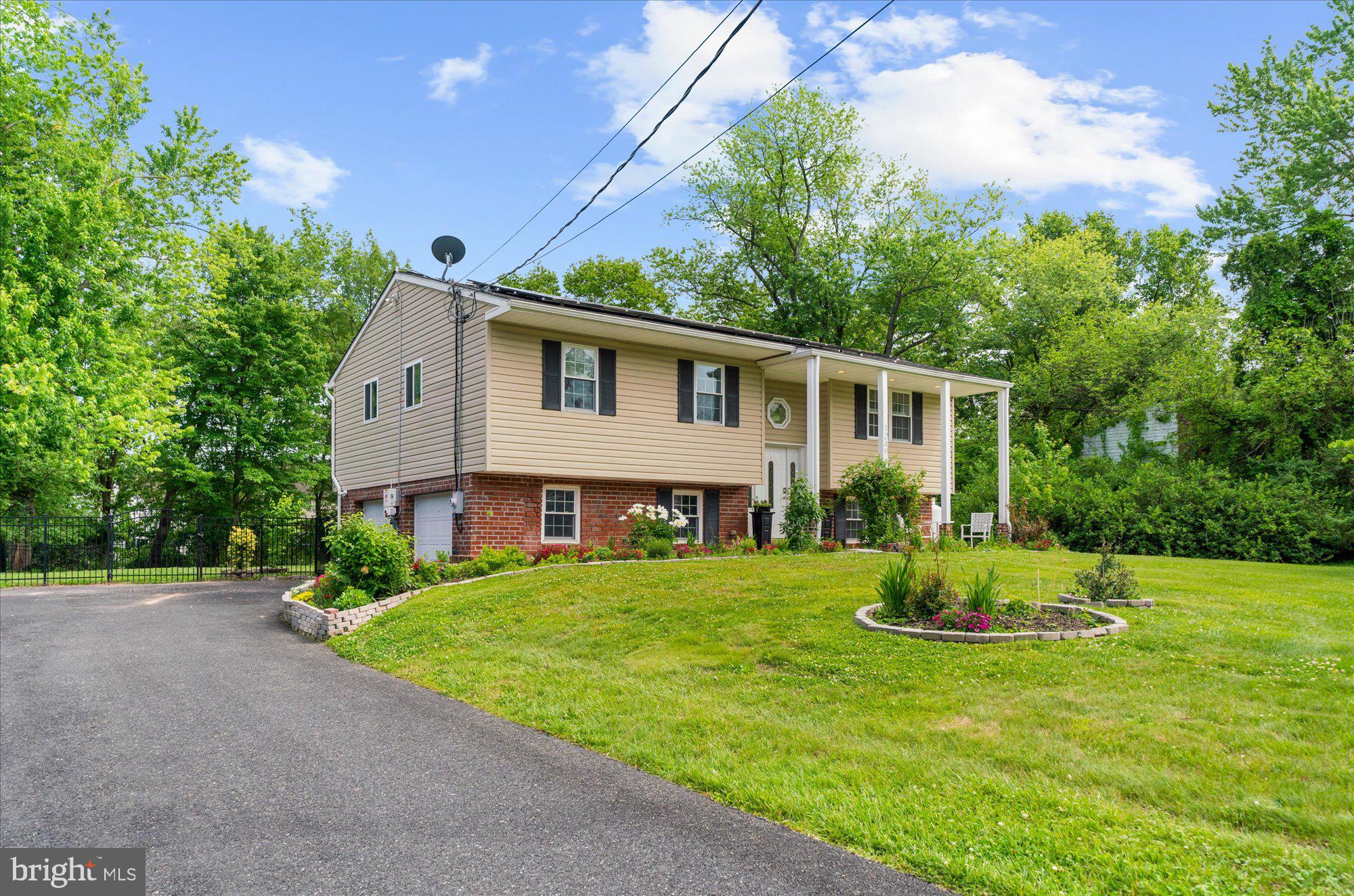 This home is a must-see! Located in the highly desirable Evergreen Acres community, this completely move-in-ready bi-level home offers 4 bedrooms and 2.5 bathrooms. Sitting on a picturesque half-acre lot — truly a nature lover’s paradise. The upper level features a spacious and sun-filled living area, perfect for relaxing or entertaining guests. Hardwood floors and fresh paint throughout the interior create a warm and welcoming feel from the moment you enter. Toward the rear of the home, you’ll pass through a versatile bonus room before entering the beautifully updated eat-in kitchen, complete with a generously sized island and plenty of space for gathering. Just off the kitchen, step out onto the deck overlooking the large, fully fenced backyard. On the opposite side of the upper level, the primary suite offers ample closet space and a private ensuite. Two additional bedrooms and a full hall bathroom complete this floor. The lower level provides even more living space with a large family room, a half bathroom, laundry room, and a fourth bedroom — ideal for guests, a home office, or additional living flexibility. From this level, you’ll also enjoy convenient access to the attached 2-car garage and backyard. All of this is located just 5 minutes from downtown Phoenixville, with easy access to parks, trails, shopping, dining, and major roadways. Don’t miss your chance to see this one-of-a-kind home!
