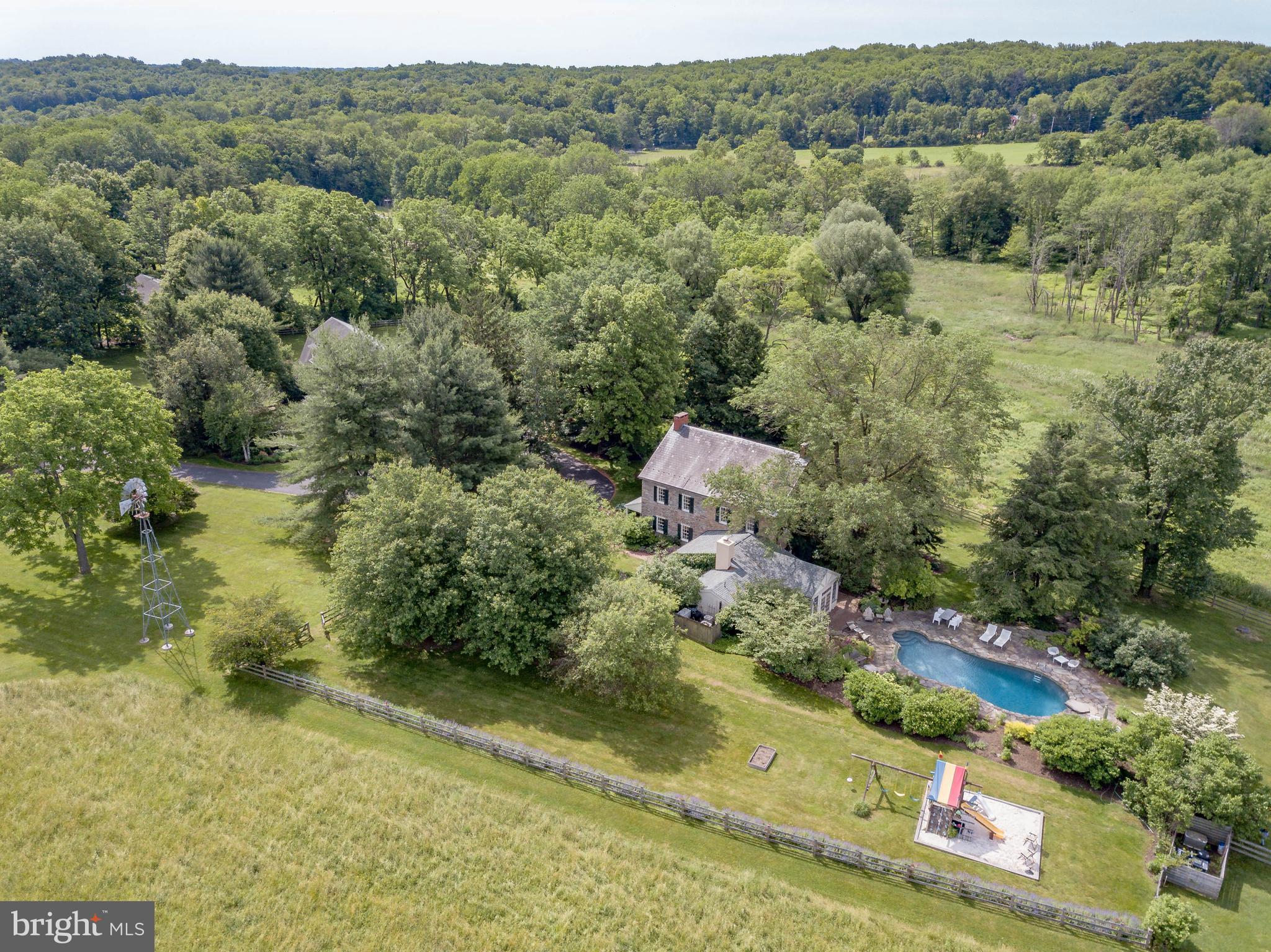 Visit https://bit.ly/2146California3D for a 3D walkthrough, and https://www.seetheproperty.com/u/316740 for photos, floorplans and more!   Tranquility and a bit of heaven, Cooks Creek Farm is one of the jewels of Bucks County.  Historically, these stone manor houses were built with southern exposure to capture the light, positioned on the high point of their acreage to overlook their fields and pastures, and with long driveways leading past bank barns and farm buildings. Such bucolic settings are rare now  but amongst them, this gracious gentleman s farm stands out as an example of the very best.The approach, down a half mile long drive, across a bridge over Cooks Creek, brings one to the center of a 34 acre Bucks County estate. The imposing stone manor house, with lovely vistas from every window, is in impeccable order.  Quintessential  is the best adjective to accompany every description of this circa 1751 farm, part of an original William Penn grant. Whether it is privacy, beauty, architecture or history that you desire, Cooks Creek Farm will not disappoint.Both inside and out, an 18th century character and timeless dignity are evident. Enhanced with upscale appointments, this historic home welcomes and envelops with warmth and grace. The foyer and living room, both with Moravian fireplaces, are testament to the home s pre-revolutionary heritage. A stunning kitchen renovation showcases honed marble, custom cabinetry and top-of-the- line appliances. The family room, living room, sunroom, kitchen and dining room all overlook meticulously landscaped acreage and meadows that have been allowed to return to their natural definition. The first floor layout invites elegant entertaining, and each room is richly-laden with exemplary woodwork. Throughout the house there are six fireplaces. On the second floor, there is a master suite with fireplace, and a luxurious new bathroom and spacious walk-in closet. Unusual for a home of this vintage, you can enjoy these soothing enhancements while luxuriating in the warmth that radiant-heated random width floors, deep window sills, and plaster walls can impart. Two additional bedrooms and a fabulous new bath complete the second floor. The third floor bedroom/bonus room is vaulted to embellish the space, and will be a room that family and guests request every time. With the home s generator, you can relax and invite a crowd for every holiday. Outside areas for intimate or formal gatherings abound. Patios and pool area with rock walls are nestled on the southerly and westerly sides of the home, creating a place at day s end for family and friends to gather. Weddings and other special occasions have always graced this area with memories that befit and embellish the history of Cooks Creek Farm. In keeping with the role of a bespoke Bucks County Estate, there is a charming guest cottage and a renovated Pennsylvania bank barn, offering garaging for four cars, and a party room above enhanced with two convenient bathrooms. Although PA barns are a disappearing item on our landscape, those that have been maintained and enhanced are truly a rare find. Adding to the farm s allure is a greenhouse that will let you explore your creative side.  At Cooks Creek Farm, every detail is presented artfully and joyfully, in a setting that provides seclusion in the summer and beautiful valley views in winter. This private paradise loses touch with the world just over the hills and yet remains within 15 minutes to Routes 309, I-78, and the Northeast extension of the PA turnpike. Relax and let the days settle in around you. Visit https://bit.ly/2LKJxhu to view the video and accompanying write-up by WFMZ.