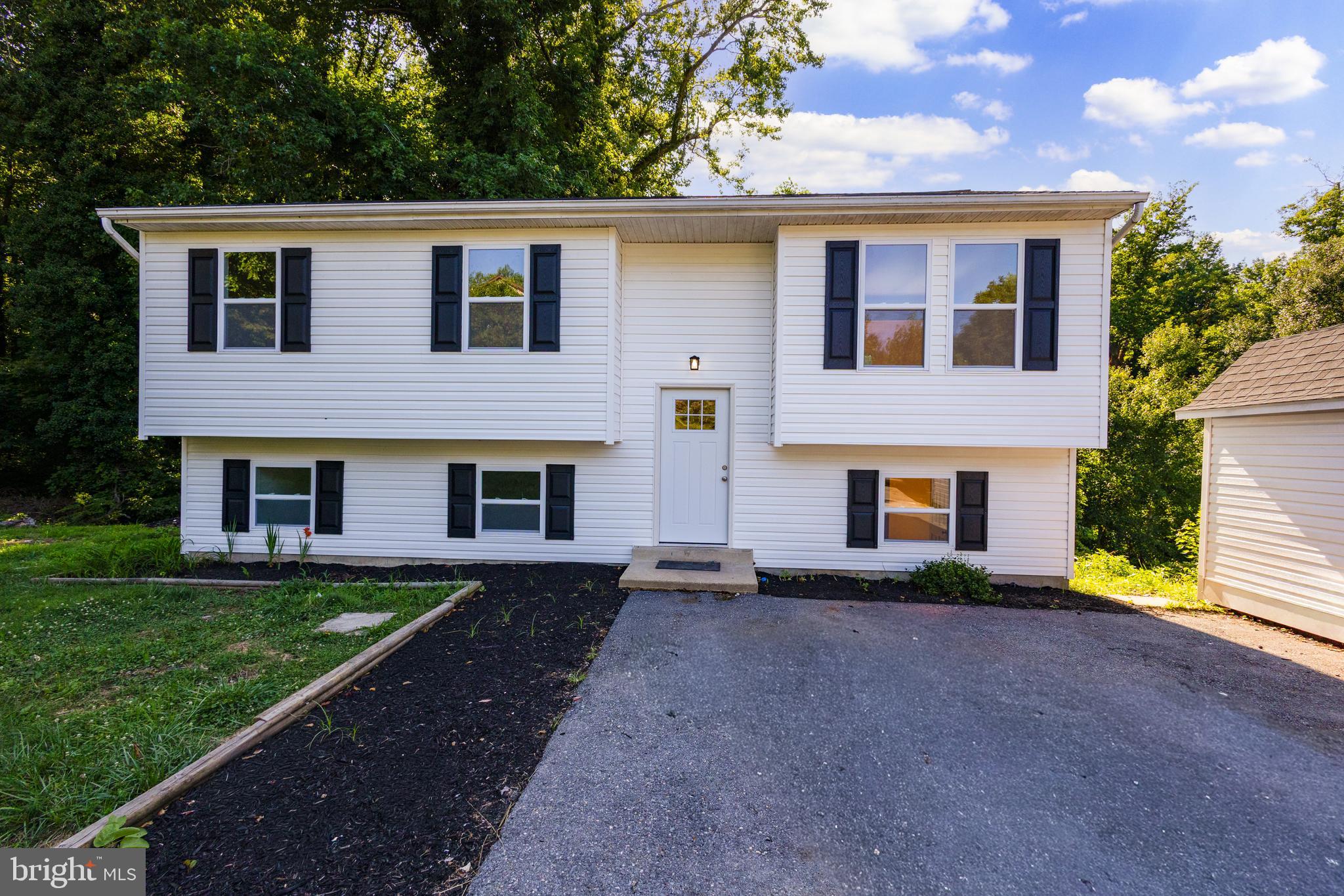 Welcome to your turn-key coastal sanctuary! This 3-bedroom, 2-bathroom home in the heart of Chesapeake Beach has been completely transformed from top to bottom. Enjoy complete peace of mind with a brand-new roof, fresh siding, brand-new deck, new flooring, and fresh paint throughout. The kitchen features modern finishes and feeds seamlessly into bright, spacious living areas, while both bathrooms are fully updated with stylish, modern touches. Outside, you'll find a spacious detached garage offering extra storage space for tools, gear, or a workshop. Situated just minutes from Chesapeake Beach amenities—including the bay, boardwalk, water park, charter fishing, and local dining. Perfect as a primary residence, coastal getaway, or turn-key investment. Move right in!