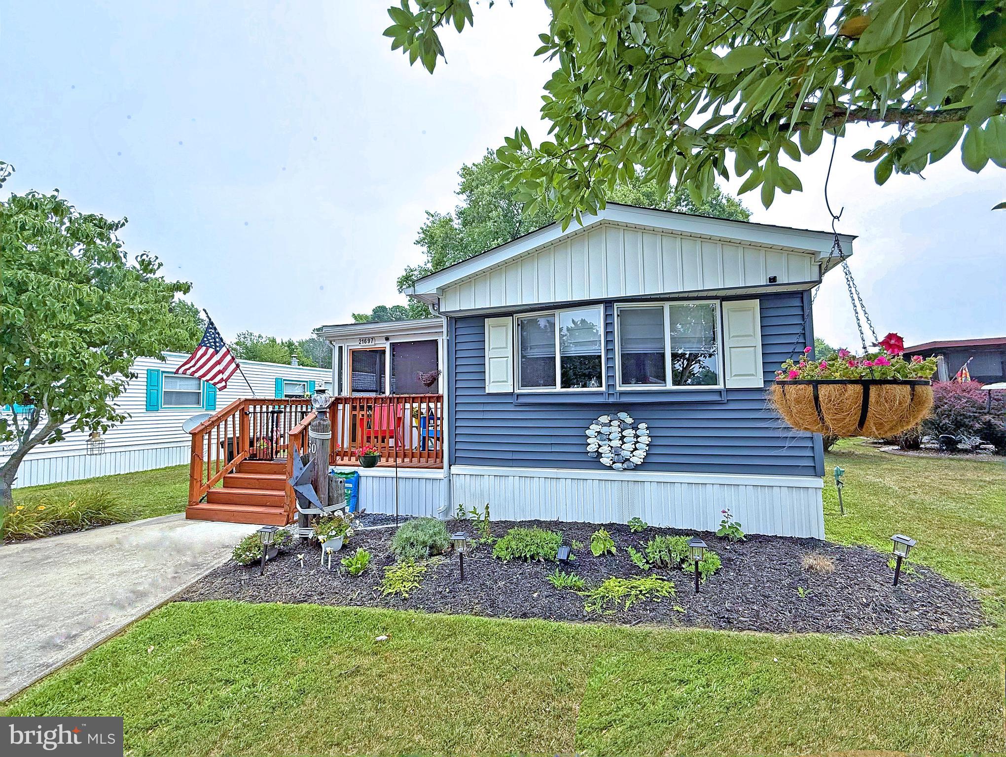 Rehoboth Bay Community has boat slips for rent, a community boat ramp, a storage area for boats/PWCs, a bayfront pool, a crabbing/fishing pier, a small sandy beach near the pool, tennis/pickleball courts & more!  And it is just 6.5 miles to the famous Rehoboth boardwalk. This 1981 Berkshire singlewide manufactured home has been nicely updated inside and out. It features newer vinyl siding, and a new A-frame shingled roof was added in 2024. The inside had extensive remodeling, too, in 2024. All new flooring in the main living area and kitchen. The kitchen remodel included soft-close cabinetry, granite countertops, and new stainless steel appliances, including a fridge that makes “fancy” cocktail ice cubes. Smooth-top electric range, built-in microwave & a farm sink. The Seller also had a half-bath powder room added to the kitchen near the dinette area. Additionally, the main bath was updated...so just about everything in this home is new. Hall laundry with a full-size washer & dryer set. You are going to love the screened porch for those days after being out on the boat, by the pool, or at the beach. Front porch, rear deck. Storage shed. Newer water heater. Brand new 2-ton HVAC system was installed December 2025. Updated electric panel. Sale will include the four (4) custom-made bunkbeds in the back bedroom. Golf carts are permitted.  The community allows 2 pets (no fences, though).  Leasehold Interest: Lot Rent of approx. $743.90/mt. includes water service & trash/recycle. (Delaware law caps rent increases as per 25 Del. C. Sec 7050-7054 with Lease renewals on Jan. 1). Homeowner pays electric, sewer, LP gas, cable/Internet, and lawn maintenance.  Hometown America, the community owner, requires an Application from the Buyer (and all adult occupants 18-year-of-age or older), with acceptance based on the following criteria: 1.)income verification, 2.)credit bureau score, plus evaluation of debt-to-income ratio, and 3.)criminal background check. Note: Family & friends may always visit, but no short-term rentals (rentals for 6mts or longer may be approved by the Community Manager.) Financing may be available to qualified borrowers from only a very few Lenders who specialize in installment/chattel loans for manufactured homes on leased land. Closing costs will include a real estate transfer tax (3.75% DMV Doc Fee) & a Settlement Agent fee.