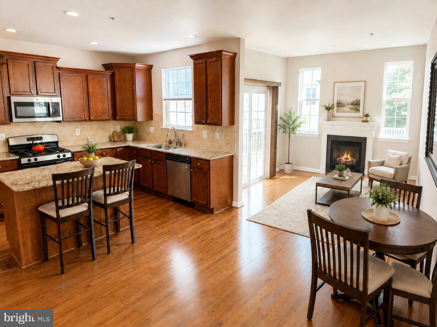 Welcome to this beautifully maintained, move-in ready smart home in the sought-after resort-style community of Tanyard Springs. Freshly painted and offering over 2,500 finished square feet across three levels, this home combines everyday comfort, flexible living space, and valuable recent upgrades, including a 2022 roof with a transferable 50-year warranty.

The main level features an open and inviting layout with hardwood floors, a gas fireplace, and a spacious granite kitchen with center island, perfect for both daily living and entertaining. The kitchen and living areas flow seamlessly to the updated deck, creating an easy indoor-outdoor connection for relaxing, grilling, or hosting.

Upstairs, the vaulted primary suite offers two walk-in closets and a generous en-suite bath. Two additional bedrooms, a full hall bath, and convenient upper-level laundry complete the bedroom level. The finished walk-out lower level adds excellent flexibility, with space for a recreation room, home office, gym, guest area, media room, or additional lounge space, plus a half bath for added convenience.

Thoughtful features and upgrades set this home apart, including an Alexa-enabled smart home system, EV charging station, wired sound system, whole-house surge protector, reverse osmosis filtration system, and high-speed internet wiring supporting up to 5GB service. The windows and garage door were recently serviced, and the seller is providing Home Warranty until 2027, offering added peace of mind.

Parking is easy with a two-car garage plus additional parking directly in front of the home. Residents of Tanyard Springs enjoy an impressive amenity package, including a community pool with toddler pool, clubhouse, 24-hour fitness center, tennis courts, basketball court, playgrounds, dog parks, walking trails, pavilions, community garden, sports fields, and over 100 acres of common area. A nearby walking path also provides convenient access to the elementary school and park.

Ideally located with easy access to MD-100, I-695, and I-97, and convenient to Fort Meade, NSA, U.S. Cyber Command, Curtis Bay Coast Guard Station, the U.S. Naval Academy, Baltimore, Annapolis, and Washington, D.C. This is a polished, spacious, and well-equipped home in one of Glen Burnie’s most amenity-rich communities.
