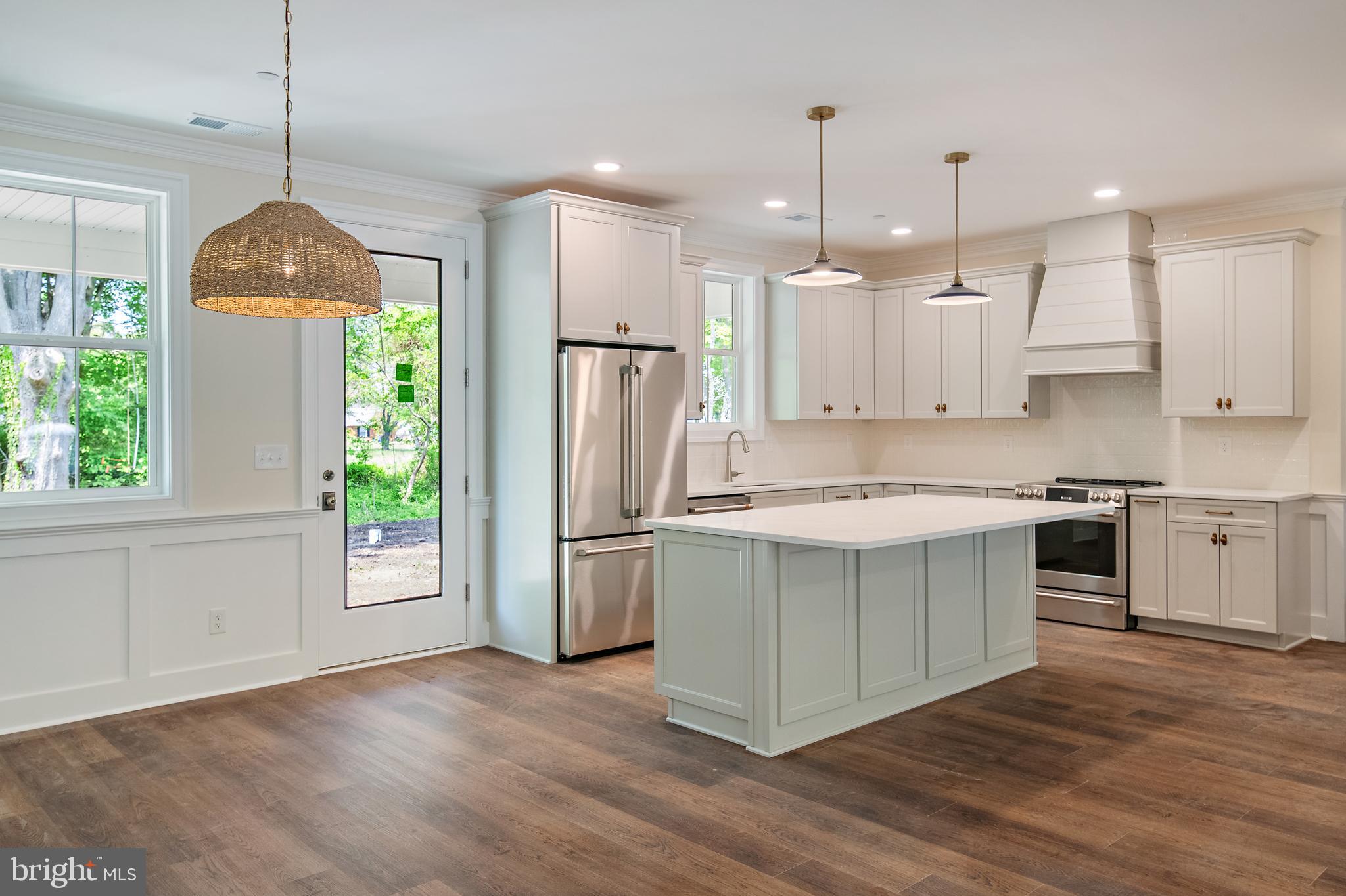 Open House Sunday June 31st from 12-2PM, please join us! STUNNING NEW CONSTRUCTION located within the highly sought-after water-access community of Queen Anne’s Colony. Welcome to the Talbot, a beautifully designed, single-level residence offering over 2,000 square feet of thoughtfully designed living space, complete with 4 bedrooms and 2.5 baths. This exceptional coastal Craftsman-style home on Kent Island blends modern luxury, elegant design, and upscale finishes. The exterior showcases HardiePlank lap siding, signature Craftsman-style double columns, and a full-length front porch that creates inviting curb appeal, along with upgraded front and garage doors that enhance the home’s character and charm. Inside, the open-concept kitchen is beautifully designed, featuring upgraded cabinetry with dovetail construction and soft-close doors and drawers, quartz countertops, and a high-end GE Café appliance package. Additional highlights include a custom trim package that includes a brick-surround fireplace flanked by custom built-in shelving units, a soaring cathedral ceiling in the Great Room with white painted beams and shiplap trim, durable luxury vinyl plank flooring throughout the main living areas, and beautifully tiled shower surrounds, offering both style and functionality at every turn. Enjoy an unbeatable location with stunning water views, peaceful streets, and a true sense of community. Keep your boat at Queen Anne Marina within the neighborhood, take a leisurely stroll to the adjacent Blue Heron Golf Course and enjoy being just minutes from a variety of exceptional waterfront dining and local restaurants. Incredible opportunity you won't want to miss!