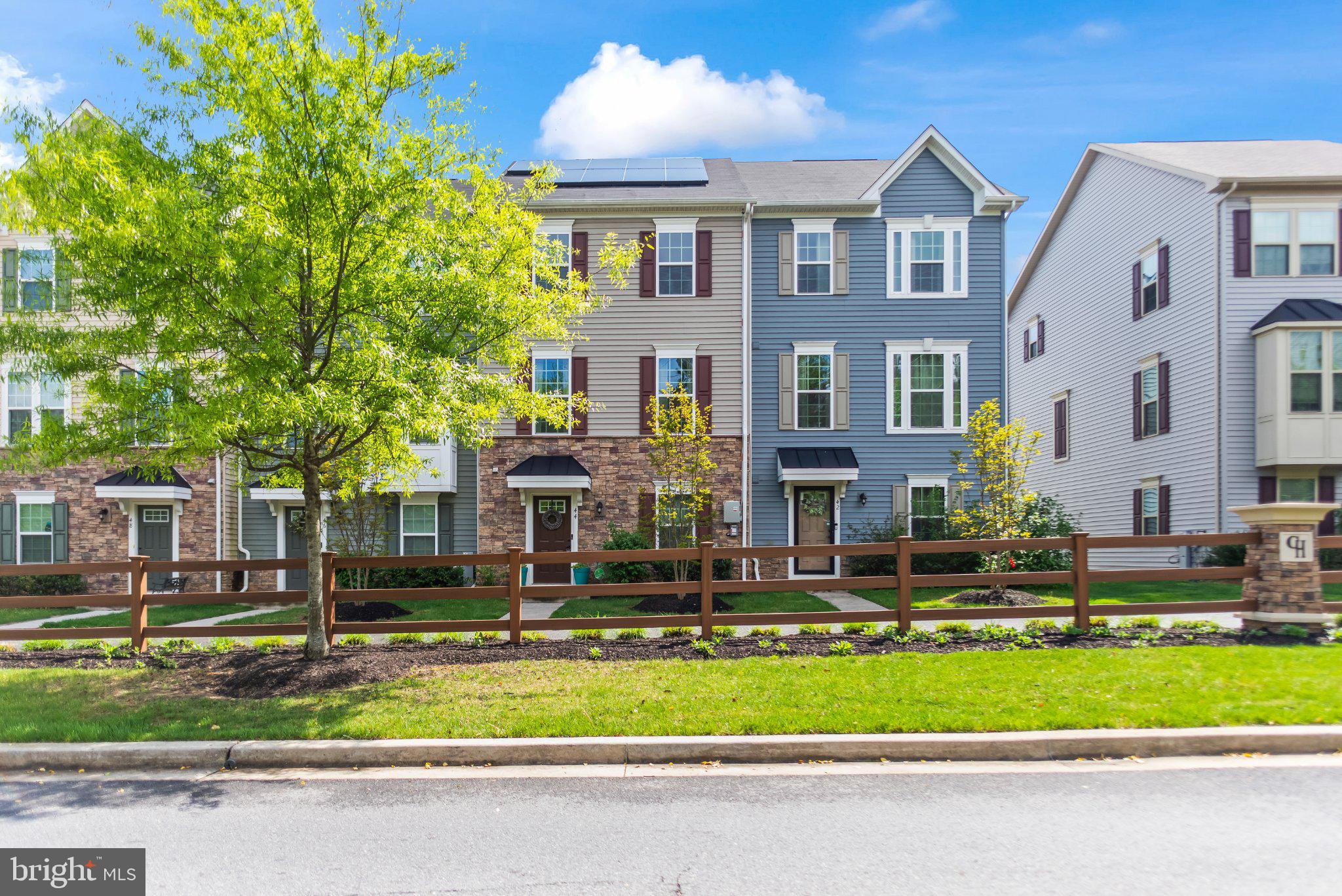 Price Improvement = New Opportunity that reflects current market activity. If you have been watching this home, now is the time to act!  

Modern, move-in ready, and built in 2020, this beautifully maintained 3-level townhome offers the perfect combination of style, space, and convenience. Featuring 3 spacious bedrooms, 2 full baths, and 2 half baths, the thoughtfully designed floor plan provides comfortable living across every level.

The open-concept main floor is ideal for both everyday living and entertaining, with upgraded finishes throughout and a seamless flow between the living, dining, and kitchen areas. At the heart of the home, the kitchen showcases contemporary design, abundant cabinetry, and an oversized island with seating for 4-5—perfect for gathering with family and friends.

Step outside to the private deck, an inviting space for morning coffee, outdoor dining, or relaxing at the end of the day. The 2-car rear-entry garage offers added convenience and valuable storage space.

Energy-efficient leased solar panels help enhance sustainability while offering potential utility savings. Residents of Cedar Hill enjoy access to exceptional community amenities, including a clubhouse, fitness center, and swimming pool.

Ideally located just minutes from I-695, I-895, and I-295, this home provides easy access to shopping, dining, and commuter routes. Combining modern design, low-maintenance living, and desirable community amenities, this is an opportunity you won't want to miss.