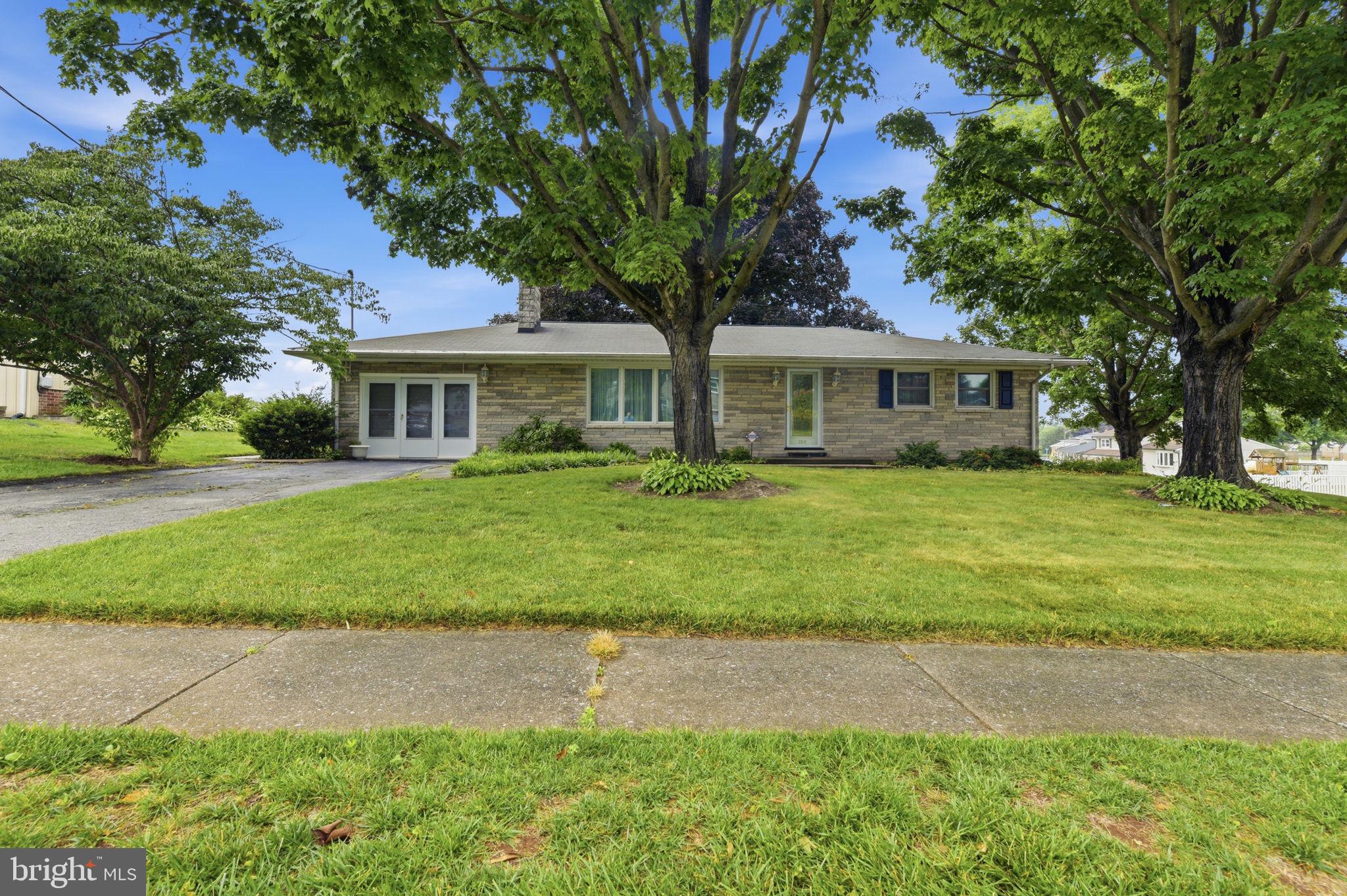 Nestled in a charming and easily walkable neighborhood, this delightful ranch-style home offers a perfect blend of comfort and community. Built in 1960, this one owner, well-maintained brick residence boasts 1,534 square feet of living space, featuring three bedrooms and two full bathrooms, ideal for creating lasting memories. As you step inside, you'll be greeted by the warmth of a large living room with an inviting fireplace, perfect for cozy evenings with loved ones. The full, partially finished basement provides endless possibilities for customization, whether you envision a playroom, workshop, or additional storage space. This well-manicured, corner lot property is situated on a quiet, dead-end street surrounded by friendly neighbors and a welcoming atmosphere. Enjoy the convenience of nearby parks, where you can take leisurely strolls, have picnics, walk with your furry friends or catch a local baseball game. With easy access to public services and amenities, everything you need is just a short drive away. This home is not just a place to live; it's a place to thrive. Experience the joy of community living in a home that offers both comfort and potential. Don't miss the chance to make this charming residence your own!