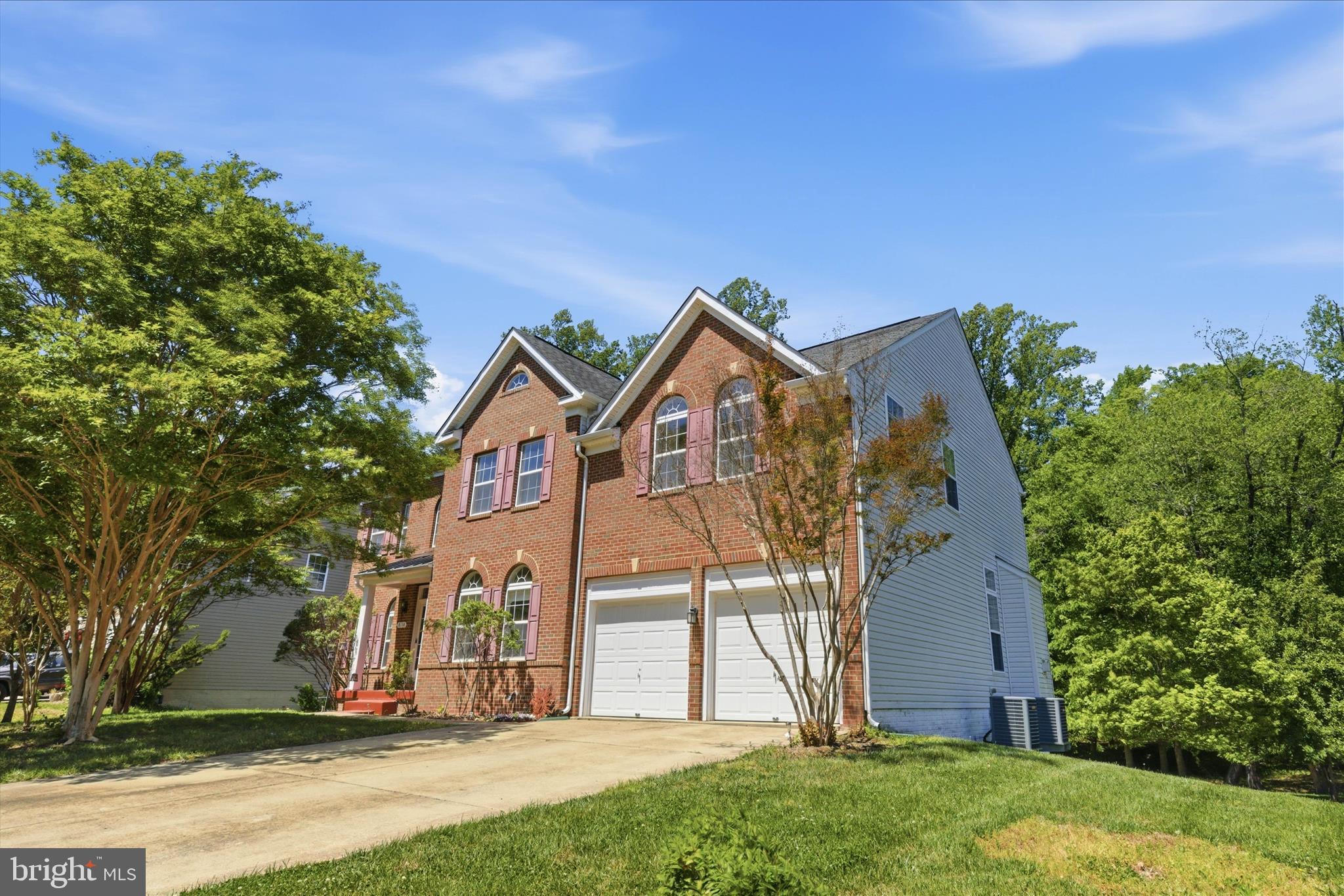 NEW PRICE! Discover exceptional value in the desirable Poplar Hill community with this spacious Colonial situated on nearly .87 acres and offering almost 4,000 sq ft above grade plus an additional 1,882 sq ft unfinished walk-out basement ready for your future vision. Move-in ready and designed for comfortable living and entertaining, this home features hardwood flooring, dual staircases, formal living and dining rooms, a private office, and a spacious family room with a gas fireplace. The gourmet kitchen offers granite countertops, double wall ovens, electric cooktop, pantry storage, abundant cabinetry, and a full appliance package. Upstairs, the expansive primary suite includes a sitting area, two-sided fireplace, dual walk-in closets, and a luxurious bath with separate vanities, soaking tub, stall shower, linen closet, and private water closet. Generously sized secondary bedrooms and upper-level laundry add everyday convenience. The unfinished walk-out basement already includes a full bath rough-in and offers endless possibilities for a recreation room, home theater, gym, guest suite, additional bedrooms, or multi-generational living. Outside, enjoy the stately brick front, freshly painted front porch, attached two-car garage, oversized driveway, mature fruit trees, and a spacious backyard with plenty of room to create your ideal outdoor retreat. Conveniently located near Joint Base Andrews, Washington DC, National Harbor, Northern Virginia, shopping, dining, and major commuter routes. Seller is offering a one-year home warranty and $2,000 cosmetic allowance. Motivated seller welcomes reasonable offers and can accommodate a quick settlement.