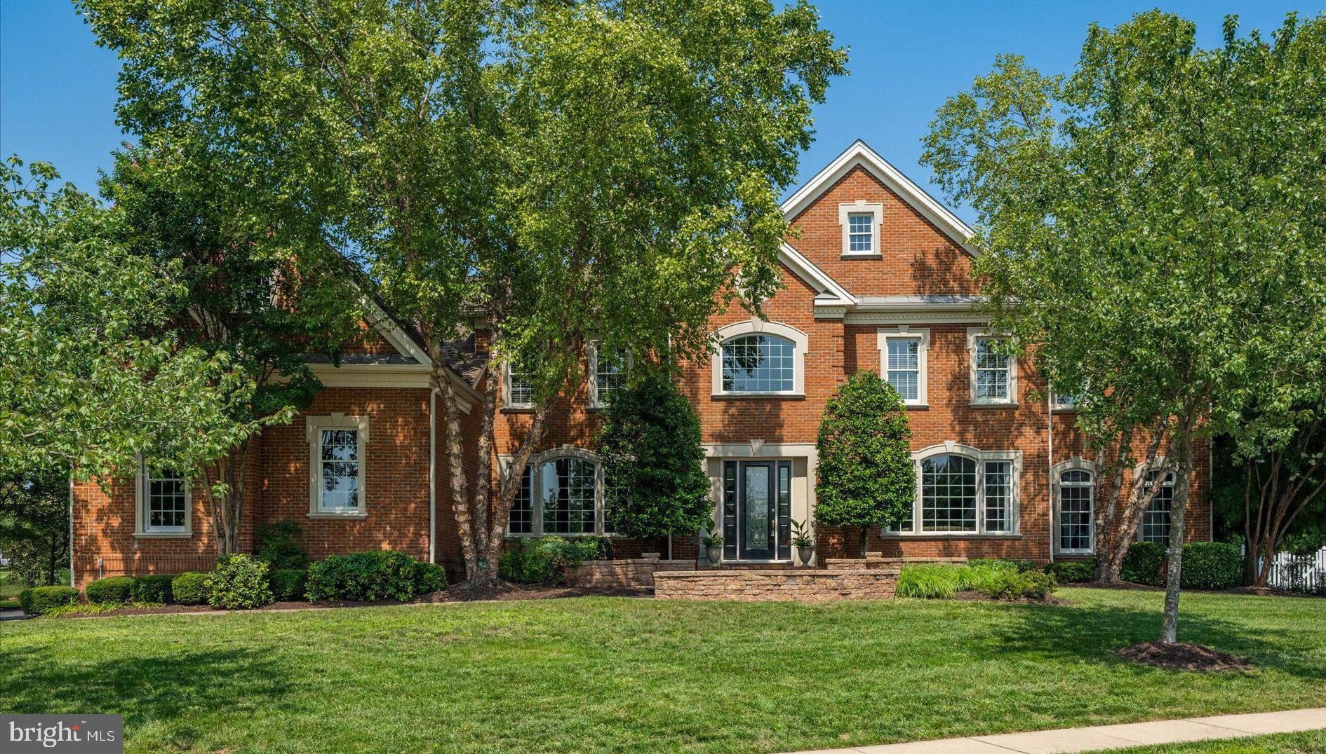 "Spectacular" is this Henley Model with Dual Curved Staircase and All The Structural Options that Toll Brothers Offered.  The First Floor is Expanded by the Conservatory Addition which Provides a Great Entertaining Space with Custom Wet Bar!  The Expanded Family Room features a Beautiful Stone Fireplace!  The "Potomac" Kitchen Option features Custom Cabinetry, Professional Appliances, a Workstation & Butlers Pantry!  The Palm Beach Sunroom Addition can be Used in a Number of Ways to Your Needs!  On the Upper Level You'll Love the Grand Bedroom Suite with Sitting Room and Den, Two Walk-In Closets, A Luxury Bath with His & Hers Fixtures & Ultra Shower!  The Finished Attic above the Suite Offers a Variety of Uses and is Very Cool!  The Additional Bedrooms feature En Suite Baths and Two of Them Have Sitting Rooms!  The Upper Level Also features an Additional Family Room!  The Enormous Lower Level features a Kitchen/Bar, a Huge Recreation/Game Area, a Huge Exercise Room and an In-Law/Nanny Suite (not a legal bedroom) with Full Bath!  Outside, You'll Love the Entertaining Styled Patio with Water Feature and Stone Fireplace!  Fenced Backyard, Three Sides Brick, Irrigation System & Landscape Lighting!