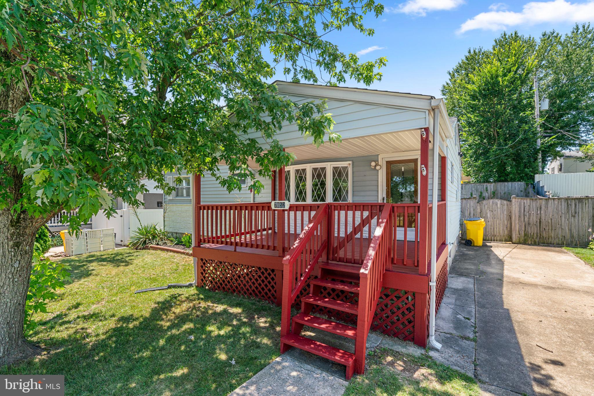 Gorgeous renovated home with so many features!  Covered front porch and a covered rear patio plus a fenced backyard.  The living room has a gas fireplace and is open to the kitchen featuring 42" cabinetry, a breakfast bar and table space.  Luxury vinyl flooring throughout.  The main level renovated bathroom has a walk-in shower and updated vanity, sink and toilet plus a heated towel rack.  The bedrooms are generously sized and the entire house was just painted.  The lower level is a dream with a massive family room with windows, recessed lighting, LVP flooring, a full bathroom with tub/shower, storage space plus a utility/storage room with laundry.  The backyard includes a large storage shed.  Lavish landscaping out front and a peaceful location on a quiet street.  This one is a winner!