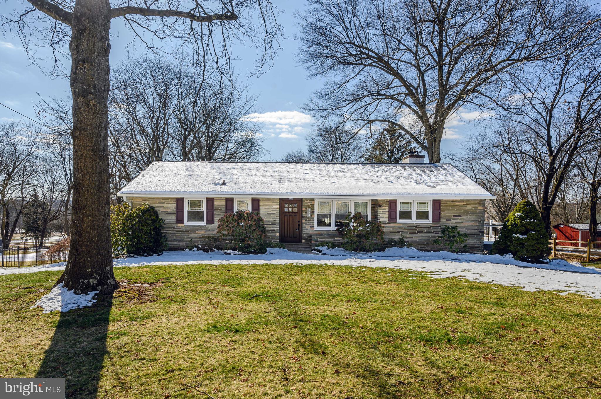 Welcome to this lovingly maintained ranch home, located within the award-winning Hatboro-Horsham School District,  in beautiful Horsham Township!  As you make your way up the brick walkway and enter the home, you will immediately realize pride of ownership is evident throughout.  This home features hardwood flooring throughout most of the main level.  The kitchen was beautifully renovated with new cabinetry, soapstone countertops, farmhouse sink, new stainless appliances, a wine cabinet, 12 panel glass door leading to the lower level, LVT flooring, plus enjoys a door leading to the private side deck, perfect for summer entertaining.  Adjoining the kitchen is a dining area which flows seamlessly into the livingroom, featuring handsome built-in cabinetry and a wood burning stove with stone fireplace surround, and a large window offering serene views of the yard and adjoining park.  Follow the hall to the three generously sized bedrooms; the main bedroom enjoys a custom closet.  The hall bath has been very nicely updated with ceramic tile floors,  new vanity, and shower enclosure.  The partially finished lower level is truly a bonus, highlighted with durable  LVT flooring, recessed lighting, and is perfect for an extra TV room, game or workout room, and features a custom barnwood wall and cabinet (perfect for bar or wine storage), featuring antique wood and metal doors.  The updated powder room is conveniently located next to the family room.  An outside exit brings you to the large patio area and opens to the large yard area, which backs to a park with walking trail.  The long driveway bring you to the back of the house and rear-entry garage, and offers ample parking for multiple vehicles.  New roof in 2021, new hot water heater in Jan., 2024, replacement windows in 2015.
The property is located  just minutes from the PA Turnpike, Routes 202 and 309, making transportation to many areas super convenient.   Horsham Township offers many walking/running trails, parks, public tennis, volleyball and basketball courts, and the very popular Everybody's Playground.  You don't want to miss this lovely home!