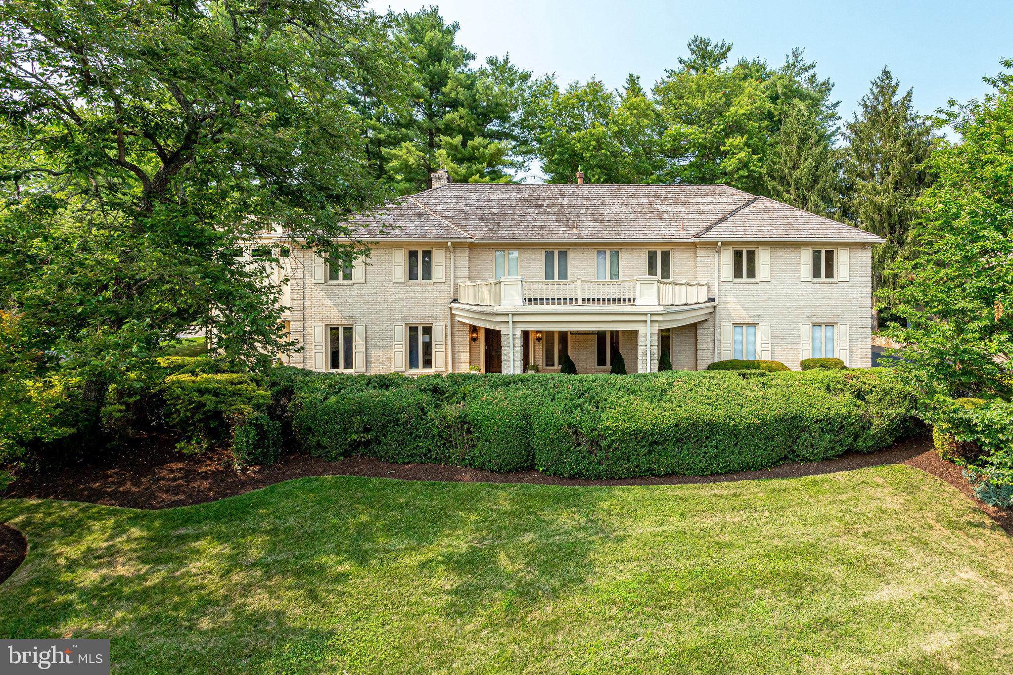 Incredible value in one of the most desired neighborhoods in McLean on a Half Acre lot Stately custom-built Expanded Brick Home has 5 bedrooms (upstairs!), 6 full baths, 2 half baths, and has 8,330 Finished Sq Ft!   Owners suite has 2 separate baths + 4 walk-in closets...a dream come true!   Fantastic open floor plan with Updated Eat-in Kitchen features granite counters, white cabinetry, peninsula island with seating, pantry, stainless steel appliances (including new wall oven & wine fridge), 2 cooktops, and large open space for kitchen table. Family Room off kitchen with double sided gas fireplace with brick accent wall. Large, sun-filled 2-story Sunroom Addition with recessed lighting, skylights, lots of windows and glass doors to patio - open floor plan allows for 2nd sitting room/playroom/2nd office! Formal Living Room with electric fireplace, marble mantel and crown molding. Dining Room with beautiful crown and chair molding, ceiling medallion and new chandelier, and built-in cabinets. Lounge/Office with wet bar, fireplace and built-in cabinets. Mud Room with utility sink, storage closets, washer/ dryer, glass door to backyard and 2nd staircase to upper level. Plus, 2 main level Half Baths. Upstairs, the Owners Suite boasts tray ceiling, 4 custom walk-in closets, and TWO separate owners' bathrooms - both with large vanities and showers with benches. Generously sized 2nd & 3rd Bedrooms with Juliet balconies that overlook the Sunroom Addition, great walk-in closet space and updated Jack and Jill Bathroom. Spacious 4th Bedroom with 2 closets, ceiling fan and 4th Full Bath with new double sink, shower tub, and linen closet. 5th Bedroom overlooks patio & 5th Full Bath located near the back staircase. Don't miss the Large Storage Room with window - spacious enough to be a private Office. On the lower level, newly renovated Rec Room with double sided fireplace with impressive stone mantel, recessed lights and large stone wet bar with sink. Large Den - great as guest room with easy access to 6th Full Bath. Separate Storage Room. Located on a private 0.48 acre lot with landscaped front yard & flat, fully fenced backyard with stone patio. NOTE: Easily expand backyard fence along Lawton St to enlarge the fenced yard significantly... it connects to the double doors from the family room addition. Conveniently located, just a half mile to 495 to GW Parkway, 2 mi from Downtown McLean, 3 Miles to Metro & commuter routes, and 10 mins to Tysons Corner Center.