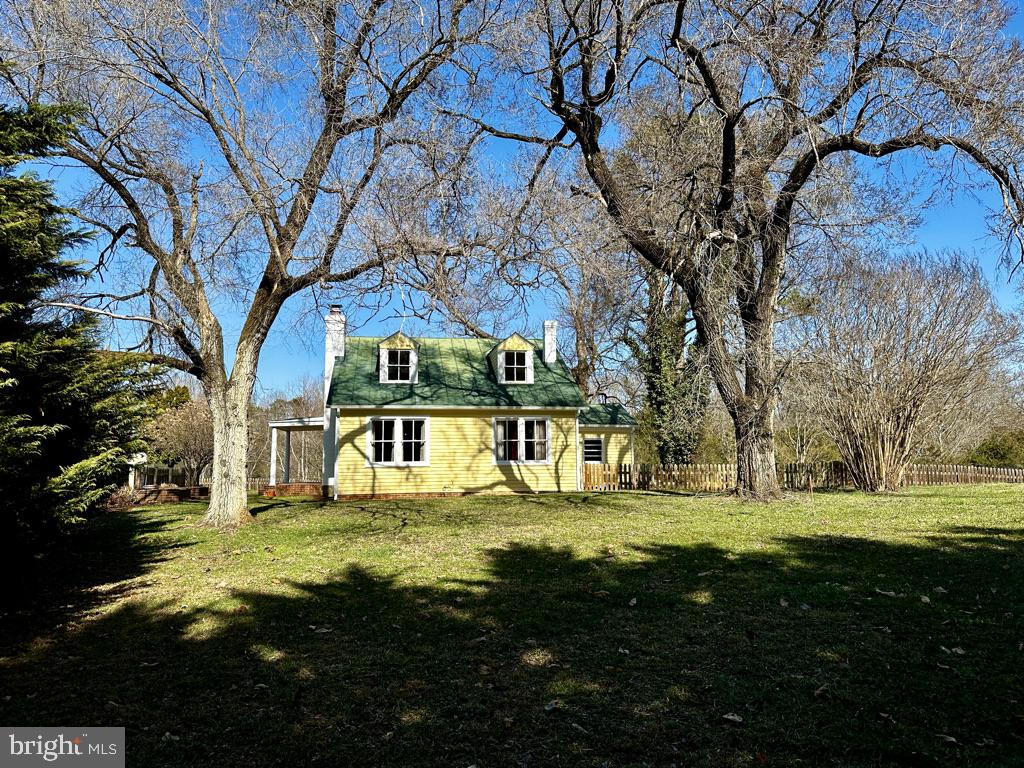 This 3 BR 1.5 BA home on 7 acres with both a creek and a spring on it, is nestled in the heart of Pratts, VA and is nothing short of Charming!! This Cape Cod Style farmhouse is Newly Renovated inside and out! It has also been engineered to split off 3.5 acres for a separate LOT at your option (approximately $100k value).  The original flooring has been sanded and refinished.  Freshly painted.  New refrigerator and late model appliances in the country kitchen.  The morning room with a built in pantry is just perfect to enjoy your wake up beverages and start your day.  A Dutch door leading to the brick patio allows for easy pass throughs to your family and friends enjoying the outdoors and views.    The living room is light filled and has a wood burning fireplace for cozy evenings.   A separate dining room has wall sconces and chandelier.  The Primary Suite has gorgeous views of the pastures and mature oak trees.  The bathroom on this level has a new tiled walk in shower, new granite topped vanity, new lighting, mirror and a separate commode room.  The interesting stairway with built in shelving, leads to the upper level where you will find two large bedrooms and a newly build half bath.     The exterior of the home has been painted, new gutters attached, fresh landscaping, chimney cleaned and fitted with new cap, and exterior lighting fixtures upgraded.  Also freshly power washed, scraped and painted are the garage and coop.  If you have outdoor hobbies, you will love the oversized garage.  The home is just a short drive to Madison, VA, Orange VA, and about 30 minutes to Charlottesville.  Yoder's Country Store is nearby, as well as Three Springs Farm which sells local meats, produce and a variety of goods.  Your slice of heaven awaits you here in beautiful Madison County.  Call or text me today to schedule your tour!