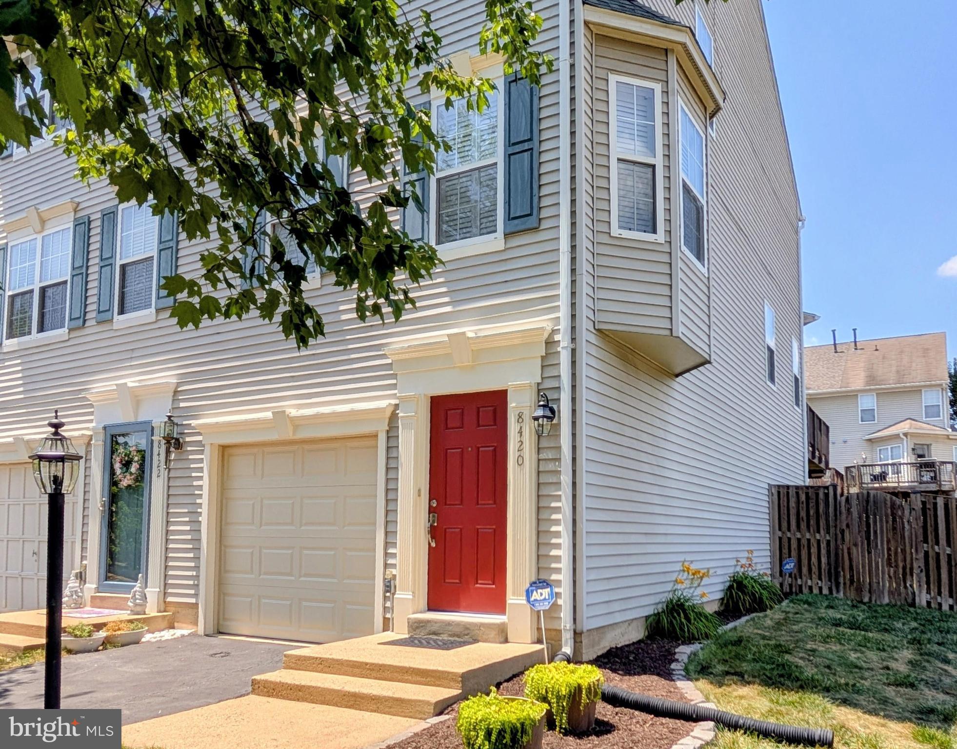 This end unit, two bedroom townhouse in the community of Kingsbrooke is move-in ready.  Enjoy natural light all day, the benefit of being an end unit.  Enter on the basement level to a tiled foyer and you will find the start of fresh paint throughout.  Newly carpeted staircase leads up to the main level, or down to the carpeted recreation room and garage entry.   Engineered wood floors complement main level.   Eat-in kitchen is located in the front of the home with granite counters atop white, soft-close shaker cabinets and a stainless steel appliance suite. Bay window in the dining area, complete with window seat, makes a perfect reading nook.  From the kitchen, enjoy an uninterrupted sight line to the living room.  Though hard to imagine in a summer heat wave, the gas fireplace is a feature you will love in the winter.  Plantation shutters on every window offer a sophisticated solution to privacy and light management. Convenient main level powder room is located between kitchen and living room.  Along an angled wall in the living room is the exit to the newly refurbished and stained deck, sitting over the fenced rear yard.  New carpet takes you up to and throughout the upper level.  A newly renovated, designer bathroom connects the primary bedroom and the second bedroom.  Stand alone soaking tub, walk-in shower and quartz counters showcasing a tall, double sink vanity are as fashionable as it gets. The primary bedroom is easily distinguished from second bedroom with its vaulted ceiling and built-in vanity counter... a great location for a private coffee bar.  Shared parking is not an issue with a one car garage and paved driveway. Corner location of this townhouse next to Braided Stream Drive allows for plenty of additional street parking for guests.  Less than four blocks to the south on Braided Stream is the Kingsbrooke community pool, tennis courts and playground.  Replacements of note:  Roof 2025, A/C 2016, Kitchen & Bathroom Updates Brand New.