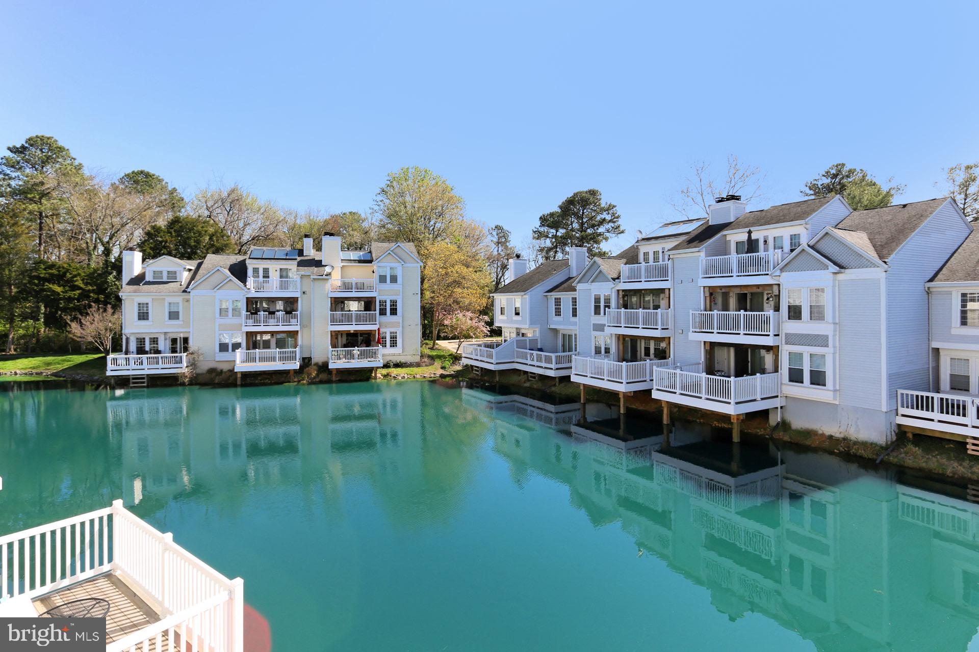 Water front condo in the heart of Falls Church!  At 1421 sq ft on two levels, this home was renovated in 2020  including paint, carpet, granite counters.  As you step inside,   there's wood flooring throughout main and a wood burning fireplace in the living room,.  There's stainless steel appliances with a newer granite counters, deep sink, microwave in the kitchen and in unit washer and dryer.  You'll find two, spacious bedrooms on this level with a full bath.  Upstairs  is a private third bedroom  with a huge walk in closet, a dedicated full bath  and a second balcony.  There's many wonderful things about this home but the first is the view!  Step out onto the balcony from the main level or from the loft to unwind and enjoy.  Second is the convenient location...close to shopping, all major roads and DC.  And lastly, there's even an extra storage space on the deck, great for all your odds and ends.  Ready for immediate move in.