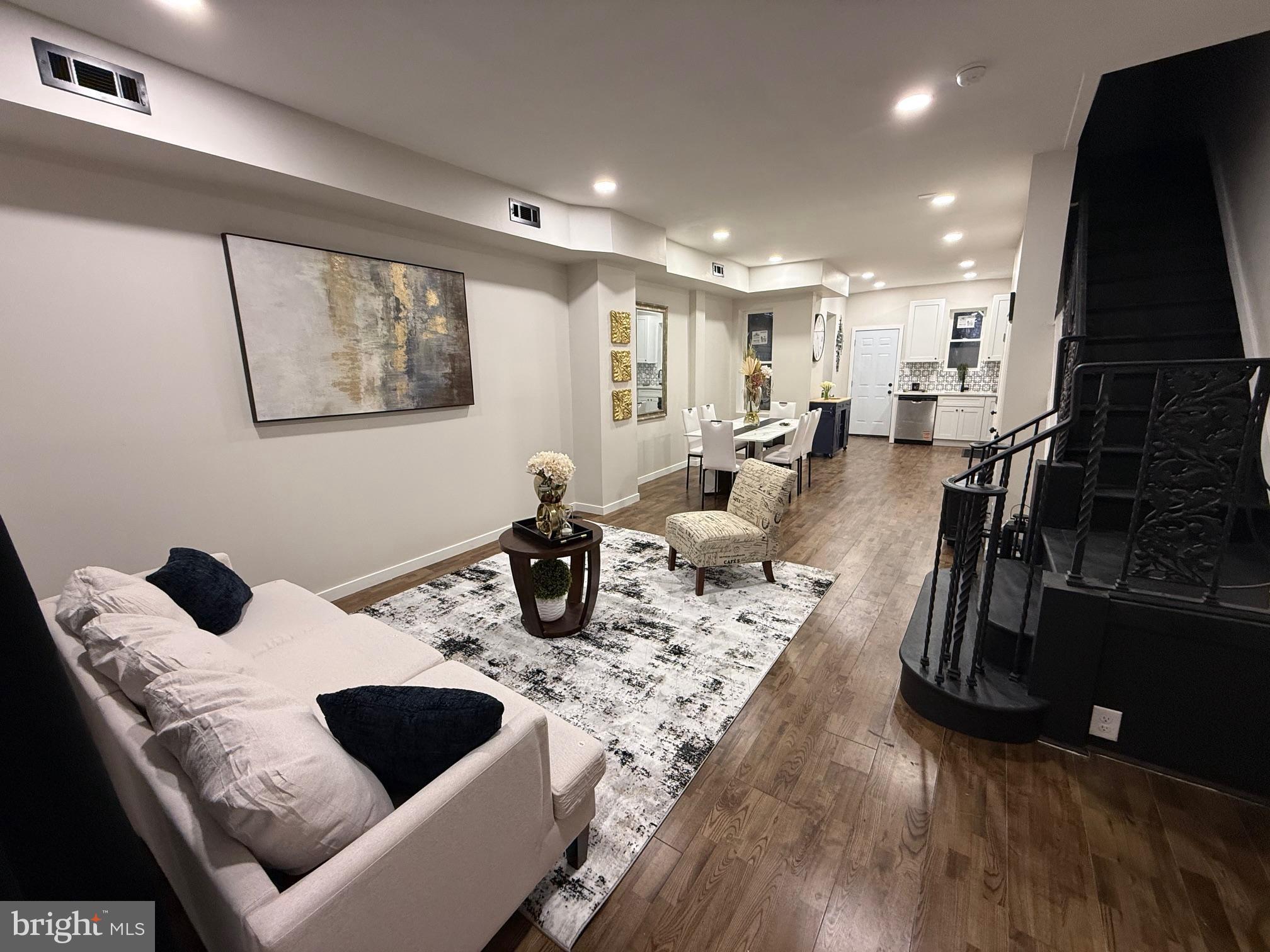 Beautifully renovated home in Parkside. Home features modern recessed lighting, expansive new windows, and hardwood flooring that flows seamlessly throughout. The open-concept living and dining area connects effortlessly to a beautifully renovated kitchen featuring quartz countertops and premium appliances. Upstairs, you’ll find three generously sized bedrooms and a fully redesigned bathroom complete with a new vanity and full-size tub.  Perfectly situated just blocks from City Avenue and Fairmount Park, this home puts you within easy reach of Saint Joseph’s University, shopping, dining, and major sports venues. Enjoy effortless commuting with quick access to I-76, US-1, and MLK Drive. Motivated Seller.