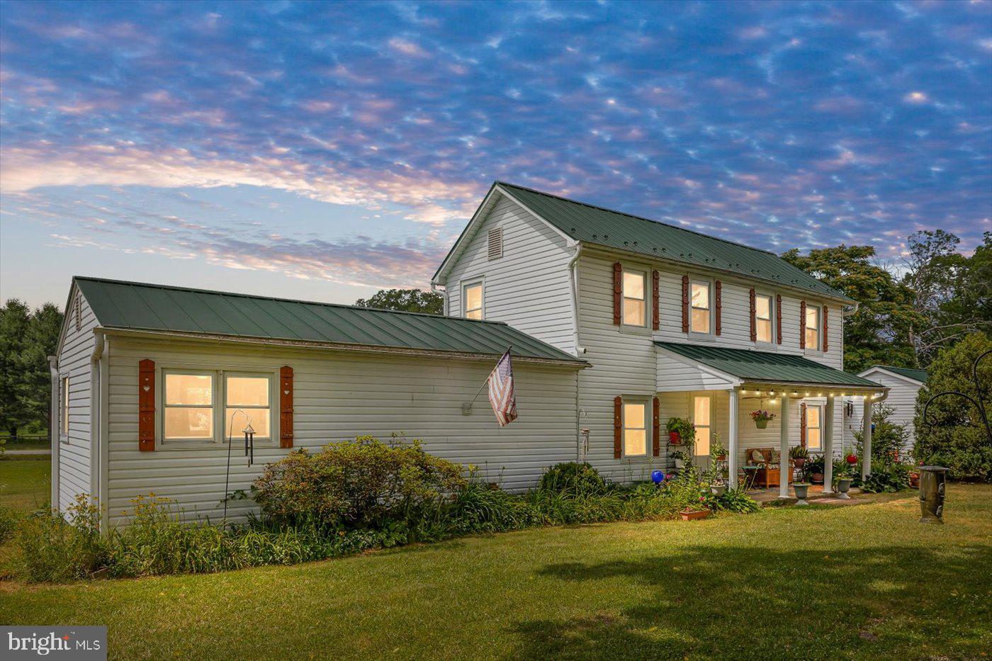 Charming Modernized Farmhouse with Historic Character in Rhoadesville, VA.  Offering 1,992 finished square feet of charm & character with 3 bedrooms, 2 full baths on 2.26 acres w/1 acre of invisible fencing. Thoughtfully updated, this home boasts newer dual-zoned HVAC, a standing seam roof & updated windows—all the big-ticket items have been taken care of for you!  Inside, a versatile layout provides flexibility to suit your needs. The main level features a primary bedroom with an ensuite bath, a family room/kitchen combination, plus the front  room is perfect for a formal dining area.  For those who appreciate vintage homes, the original structure, built as a log home in 1887, is still intact & makes a wonderfully cozy den. The main floor laundry room adds convenience, while two guest bedrooms are located upstairs.  A covered walkway connects the home to a two-car garage. Recent improvements include new flooring in the kitchen & living room, along with various other updates.  Enjoy peaceful outdoor living with a covered front porch & a rear deck, perfect for relaxing & entertaining. The landscaped property is adorned with mature trees, boxwoods, and colorful perennial flower beds.  Located in a prime spot for commuters, this home offers easy access to Culpeper, Lake Anna, Fredericksburg, & Northern Virginia. Plus, with Xfinity & Fiberlync servicing the property, you’ll stay connected while enjoying country living.  Don't miss this opportunity to own a beautiful farmhouse with modern updates & a touch of history! Schedule your showing today! Floor plan available!