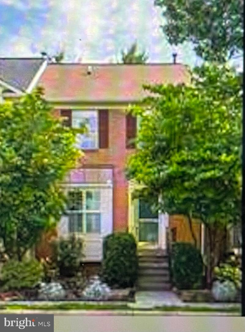 **New Photos next week**Refreshed and ready! Backing to trees in the sought-after Potomac Crossing community, this brick-front walk-up townhome pairs a light-filled, recently updated interior with easy indoor-outdoor living, all just minutes from downtown Leesburg. The home offers three bedrooms and two full plus two half baths across three finished levels. The main level centers on a living room with a fireplace and built-ins, where sliding doors open directly onto the deck and yard. A formal dining area with hardwood floors and wainscoting gives you room for both gatherings and everyday meals, and the kitchen features new stainless steel appliances and new countertops. New carpet and fresh paint run throughout. Upstairs, all three bedrooms share the same level. The primary suite has vaulted ceilings and a private en-suite bath, while the two additional bedrooms each offer good natural light and storage. The fully finished lower level adds a large, open rec room with a second fireplace, a dedicated laundry room, and generous extra storage, leaving you flexible space for a media room, play area, or home office. Additional recent improvements include updated front landscaping, all bathrooms refreshed/updated, a freshly painted deck and front exterior, and a power-washed rear exterior. Also, for peace of mind the roof is less than 10yrs old! Beyond the home, residents enjoy ample open parking in the community and easy access to Ball’s Bluff Regional Park and trails. You’re also close to shopping centers, schools, and the Leesburg Bypass, and Potomac Crossing itself offers a pool, playgrounds, basketball courts, fitness stations, and scenic walking paths. Location, layout, updates, and amenities come together here in a townhome that’s ready to move into and make your own!
