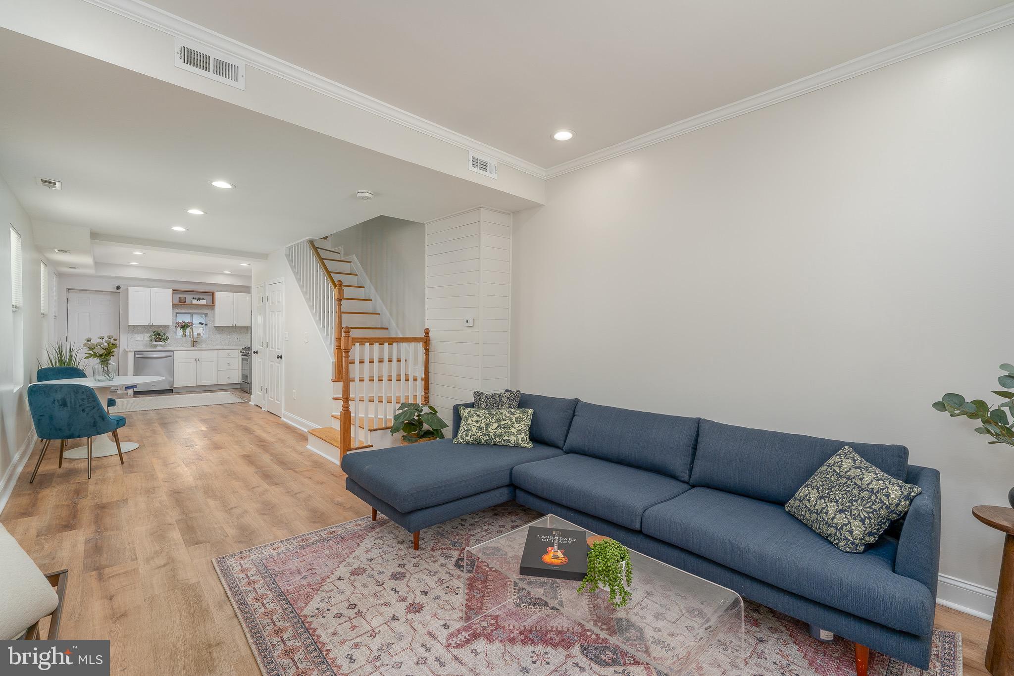 Just two blocks from Patterson Park, 139 N Port Street offers an affordable opportunity for a first-time buyer or a strong addition to a rental portfolio. This updated two-bedroom, two-full-bath home combines clean finishes, flexible living space, and the added convenience of off-street parking.

The main level is exceptionally bright, with high ceilings and abundant windows that create an open, comfortable feel. The updated kitchen is both stylish and functional. Upstairs are two well-sized bedrooms and a full bath with a double vanity. The finished lower level provides additional flexibility with a separate room, living area, second full bath, and storage—ideal for extended guests, a home office, or additional living space.

Enjoy a walkable neighborhood lifestyle with Patterson Park, La Barrita, Charm’d Kitchen, coffee shops, markets, and everyday amenities all close by. Move-in ready, well located, and priced to offer real value.