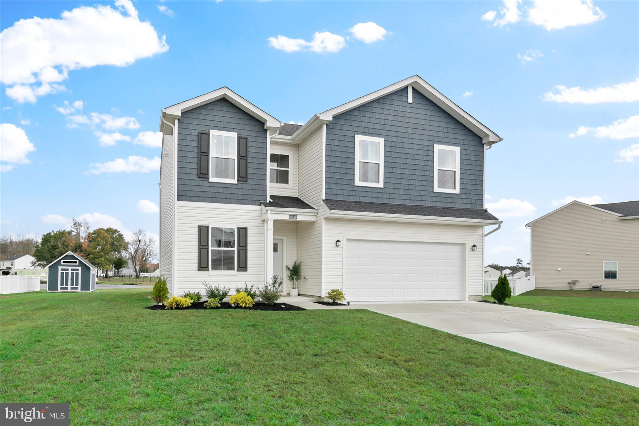 BRING ALL OFFERS! Welcome to this beautifully maintained, like-new home built in 2023, located in the sought-after community of Schooner Landing. Designed for modern coastal living, this home offers a perfect blend of comfort, style, and convenience, all just a short drive to the beaches of Bethany, Fenwick, and Ocean City.

Set on a landscaped homesite with charming curb appeal, this home invites you in through a welcoming foyer that opens to bright, open spaces filled with natural light. A carpeted front room provides a flexible space for an office, playroom, or cozy sitting area, while luxury vinyl plank flooring flows throughout the main living areas, adding warmth and durability.

The heart of the home is the open-concept living room, dining area, and kitchen, an ideal layout for both daily life and entertaining. The kitchen is a showstopper, featuring 42-inch white cabinetry, granite countertops, stainless steel Frigidaire Gallery appliances, a pantry, and a large island that provides extra workspace and seating. Gold cabinet hardware and a gold gooseneck sprayer faucet add a stylish, modern touch. Sliding glass doors lead to a spacious patio overlooking a tranquil pond, creating an easy flow between indoor and outdoor living. A shed in the backyard provides additional storage, and the two-car garage includes a tankless hot water heater and automatic opener for added convenience.

Upstairs, a bright loft offers a perfect spot for reading, lounging, or working from home. The primary suite features peaceful pond views, a generous walk-in closet, and a spa-inspired ensuite with a walk-in shower, bench seating, and dual vanities. Three additional bedrooms share a full hall bath with a tub-shower combination, and the laundry room is conveniently located on the same level for ease of use.

Residents of Schooner Landing enjoy access to community amenities including a sparkling pool and dedicated RV and boat storage, making it easy to embrace the coastal lifestyle. Whether you are looking for a full-time residence or a weekend retreat, this home offers the best of relaxed living with all the modern comforts you desire.