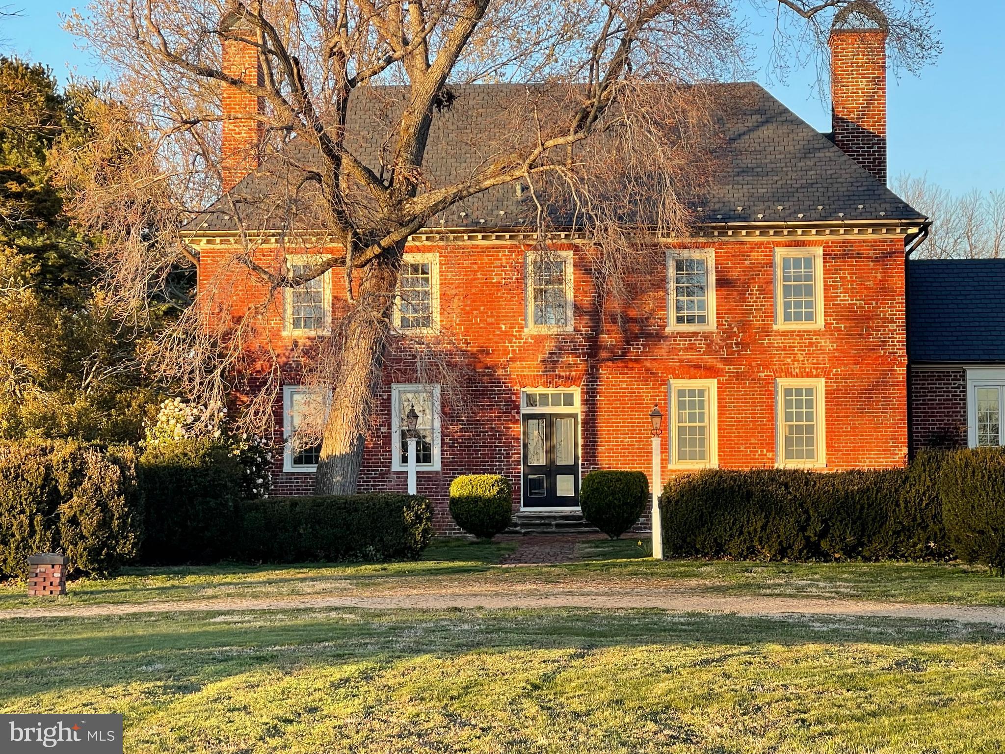 Standing the test of time, Indian Banks Circa 1699 & 1728 has witnessed over three hundred years of history & the founding of a nation.  An icon on Virginia's Northern Neck, Indian Banks is situated on Morattico Creek at its confluence with the Rappahannock River. In August 1608, Captain John Smith visited the Moraughtacund Native Americans at their principal village on the Northern Neck near present day Indian Banks. This site was patented in 1652 by Thomas Glasscock, who received six hundred acres of land on Morattico Creek in return for the surrender of a grant of two hundred acres on Piankatank River, (which he had received upon his emigration to America in 1643). In 1728, Captain Glasscock married Ester Ball (a cousin of George Washington) & took up residence here. Initials inscribed with a masonic symbol on one of the bricks contains the initials of George Washington, whom the engraving is attributed to.

The truly captivating Manor House is distinctly English in its architecture containing Jacobean elements on the North side of the house and an Early Colonial / Georgian emphasis on the river facing side, which was always the more formal, front of the house. Flemish Bond brickwork with glazed headers and a rare Scrolled Soffit above main entrance (one of only two known examples in VA) are unique architectural features of this exquisite early Manor House with a commanding presence from the Rappahannock River and Morattico Creek. Towering ancient trees frame the view from the Manor House to the water frontage. Several varieties of Magnolia, iris, peonies, figs, pecan, and other ancient plantings provide interest year-round. Rivers of Daffodils in the spring! House and  dependencies are NOT in a floodzone. 

 Featured multiple times on the Historic Garden Week in Virginia Tour, Indian Banks is convenient to Richmond, Washington D.C., Tappahannock, Fredericksburg & Williamsburg.  The location is also ideal with Kilmarnock being 20 minutes away and  Warsaw, VA being a mere 15 minutes away. 

 All of the amenities that one would associate with Northern Neck living are convenient, including nearby  marinas,  world class resorts and restaurants, wineries, festivals, fresh oysters and other seafood, boat charters, movie theaters, antiques, art galleries, museums, fabulous wineries, farmers markets, historic sites and so much more. 

 With over 300 years of history has taken place within her walls, Indian Banks is  truly remarkable find and historic treasure with  a provenance that transcends the ages!