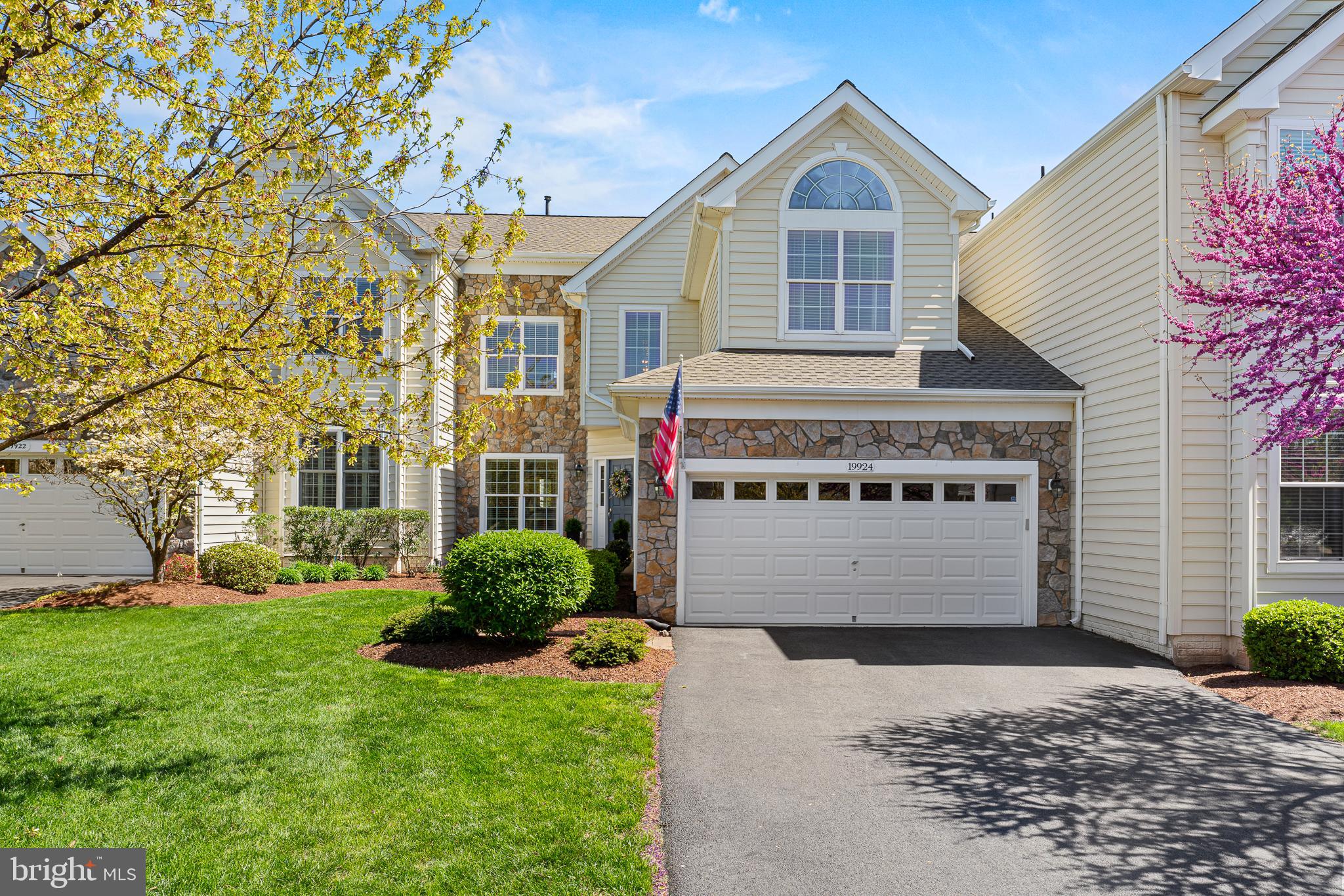 Prepare to be captivated by this exquisitely maintained Victoria model w/ loft carriage home, perfectly positioned overlooking the 8th hole of the Arnold Palmer designed Belmont Country Club! Step inside and discover a haven of refined living, boasting three generous bedrooms, a private 3rd-floor loft retreat, an elegant 2-story living room, and two and a half beautifully appointed baths. Recent major renovations in 2019 introduced stunning refinished hardwood flooring throughout the first floor, setting the stage for the gourmet kitchen of your dreams. Imagine culinary creations unfolding amidst all-new soft-close cabinetry (including additional 14" uppers!), crown molding, under-cabinet lighting, a substantial 96" quartzite island with under-counter storage, and top-of-the-line stainless steel appliances featuring a 5-burner gas cooktop, double wall oven, microwave, and chic gold-tone hardware and chandeliers. Beyond the kitchen, discover a completely remodeled laundry room offering both style and functionality with cabinetry, a front-load washer/dryer, granite countertops, LVP flooring, and a convenient laundry sink. The first-floor powder room has also been tastefully updated with a new vanity, sink, and granite countertop. Enjoy seamless indoor-outdoor living with a new all-weather deck railing installed in 2021, perfect for enjoying the serene views. Retreat to the completely remodeled primary bath, featuring a frameless shower, an expansive enlarged quartz double vanity sink, soft-close cabinets, quartz countertops, and elegant 12" x 24" ceramic tile flooring and shower area. Peace of mind is ensured with a new sump pump (2022), and essential systems have been updated with a new furnace, water heater, and A/C unit in 2023/2024. The second-floor hall bath received a stunning makeover in 2024 with a new quartz double sink vanity, soft-close cabinetry, and stylish 12" x 24" ceramic tile flooring. A new roof adds the final touch of worry-free living. Outside, discover your own private sanctuary with a stone waterfall, large deck, and patio, all enveloped by mature bushes and trees for ultimate privacy. The full basement awaits your personal touch, offering endless possibilities for customization. This is more than a home; it's a lifestyle, a perfect blend of elegance and opportunity in a coveted location.