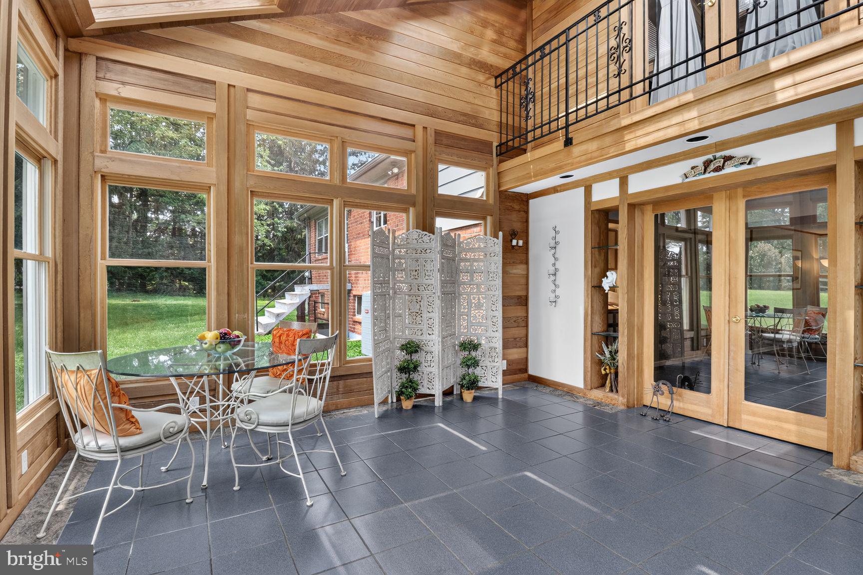 Located on the outskirts of the Ancient Oak subdivision on a large corner lot, this 4-level split blends comfort and more than 3,000 sf of living space. The ground-floor level features a cozy family room with wet bar, a two-level glassed-in sunroom addition (the current owners' primary entrance), a bedroom and full bath, plus an oversized double garage. The traditional main-floor layout includes a living room, dining room and an eat-in kitchen (ready for your updates). On the upper level are three bedrooms and two baths, including an overlook from the primary bedroom to the sunroom below. A bonus room on the bottom level could be a 5th bedroom, an office, a work-out or craft room, etc.  The expansive flat grassy lot (nearly an acre) offers ample room for outdoor activities, gardening or simply enjoying the natural setting. Mature trees and plantings make this property surprisingly private. Hot-water heater (2025), composite roof (2016), oil furnace (2013 - Burtonsville Oil), septic system (4-BR capacity; pumped every 3 years; last pumped 2025 - King & Sons), 8 exterior Amcrest security cameras (2020). Fireplace conveys as is (needs new liner). With easy access to 270, the ICC, Shady Grove Metro, and the MARC train station, plus close to shopping, schools, hospitals, and parks, this property offers a very appealing combination of location, space and privacy.