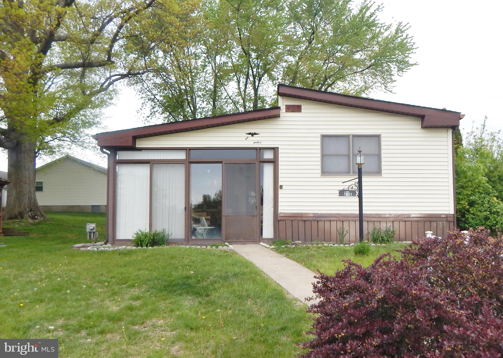 Back on the market,  buyer financing fell thru.   With 1,440 square feet of comfortable living space, this traditional-style residence offers two spacious bedrooms and two full bathrooms, perfect for relaxation and privacy.  Step into the front enclosed porch, large living room, main bedroom with its own full bath, spacious kitchen plus separate dining area, expanded den in the back was an addition that gives alot of extra space.    Head out the glass french doors to a back deck which feels very private.   The heart of this home is its warm and welcoming atmosphere, enhanced by the thoughtful layout that maximizes space and functionality.    Step outside to find additional features such as a gazebo and shed, providing extra storage and a lovely spot to unwind. The well-maintained grounds are complemented by the association's commitment to common area maintenance, trash removal, and snow removal, allowing you to enjoy a low-maintenance lifestyle. Enjoy the convenience of community amenities, including a heated outdoor pool, fitness center, and a vibrant clubhouse, fostering a sense of connection and community spirit.   The community recreational facilities ensure there's always something to do, whether it's a swim in the pool or a gathering at the community center. This home is not just a place to live; it's a lifestyle choice that emphasizes comfort, community, and convenience. Embrace the opportunity to create lasting memories in a space that truly feels like home.