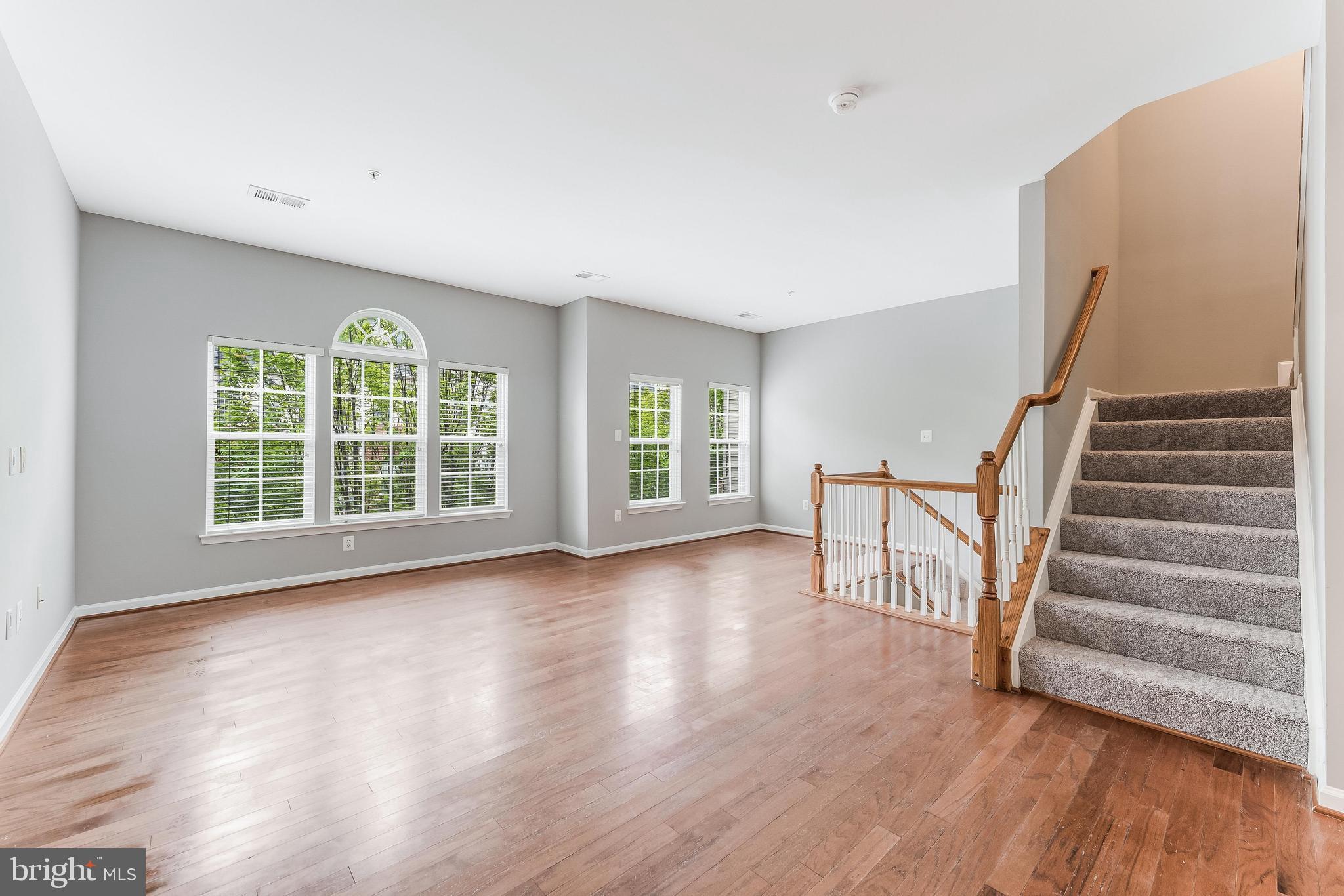 Beautiful 3-level townhouse-style condo in the sought-after Village Place community of Gainesville! This well-maintained home offers 3 bedrooms, 2.5 bathrooms, and a 1-car garage in a commuter-friendly location close to shopping, dining, and major routes. The main level features hardwood floors and an inviting eat-in kitchen with center island—ideal for both everyday living and entertaining. Upstairs, the spacious primary suite includes a walk-in closet, private bath, and private balcony—perfect for relaxing and unwinding. Recent updates include a new hot water heater (2023) and Air Conditioning Unit  (2025). Freshly painted throughout & brand new carpet . Conveniently located near Virginia Gateway (4 min drive), Old Town Haymarket (3 min drive) and within the Gainesville High School pyramid. Move-in ready and ideally located!