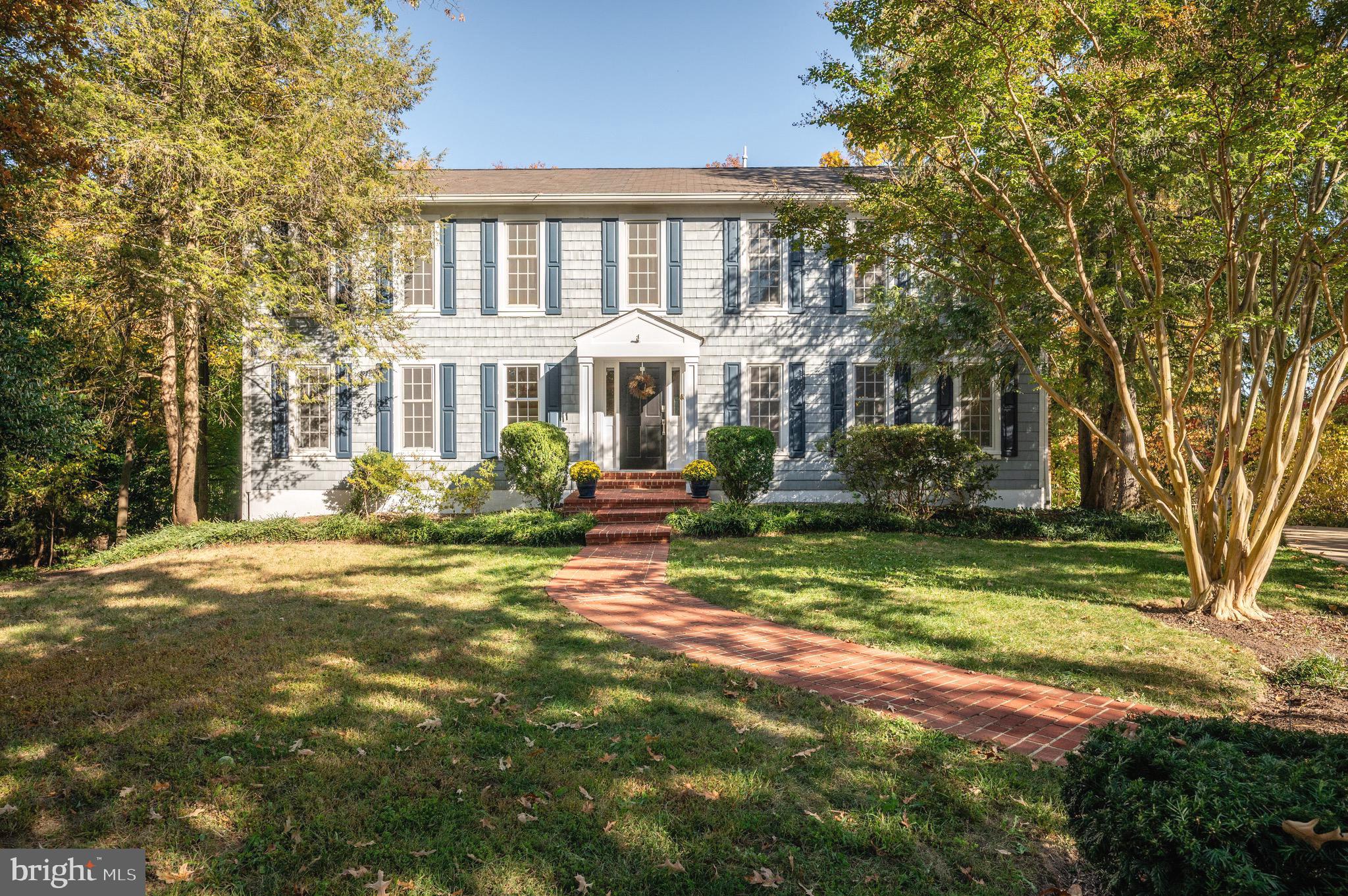You won't want to miss this detached 5 bedrooms and 4.5 bath Wellington Woods home situated on over a half acre of land! Enter into the foyer - to the right is a formal living room with  a wood burning fireplace - ideal for cozy evenings on crisp fall days! Move into the office/sitting room. This versatile space could be a playroom, library, office or sitting room. Walking into the kitchen, you will be amazed. This large space features beautiful shaker-style cabinetry, stainless steel appliances, an island for easy entertaining or everyday meals, and counter space for the gourmet chef to prep or for the everyday cook! This kitchen opens into a family room with custom built-ins, a breakfast area and a spacious formal dining area with a wood burning fireplace. The family room opens to the deck which overlooks the large yard including a peaceful stone pond with waterfall installed in 2020 - a great space for dining al frecso or working from home on warm days! Rounding out the first level is a large office - a private space that is ideal for working from home  - and a convenient half bath. Head upstairs to four bedrooms and three bathrooms plus laundry. The primary suite is a true retreat - the spacious room can easily accommodate a king-sized bed, and adjacent to the bedroom is an additional large room with a wood burning  fireplace that could be used as a sitting room, lovely office or home gym. Two walk-in closets line the path to the en-suite bathroom, which features a walk in shower, soaking tub and double vanities. The second bedroom boasts an en-suite bath while bedrooms three and four share a hall bath with tub/shower combo. A laundry room completes this level. Head to the walkout basement where you will find a large recreation room with a lovely wood burning fireplace - a great space for movie night or watching the big game! Guests (long or short term) will love the spacious bedroom, private bath and kitchenette. A large playroom/game room area sits to the rear of the basement and has tons of light with double glass French doors leading to the rear patio and yard. A second laundry room and access to the two car garage wind out this level. The two car garage is great for parking, storage and more! There is also a separate storage room right outside the garage which is climate controlled! You will love living at 900 Clifton Drive - a great location just steps to the Mount Vernon Trail and minutes to Old Town, so private and serene you will feel like you are worlds away! Welcome home!