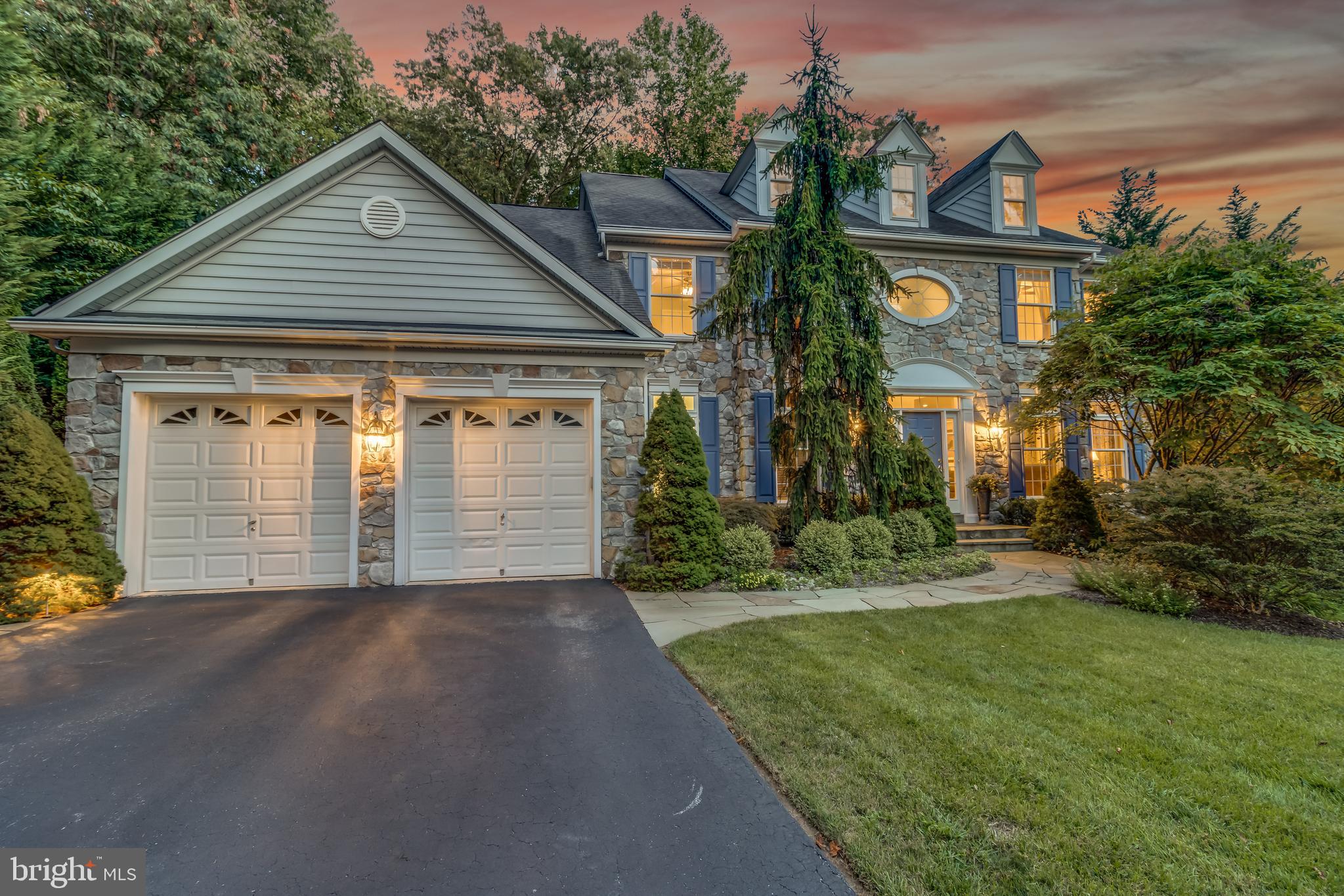 What a pleasure this Colonial is to view! Stone framed home with professional landscaping and winding walk way leads you to a gracious foyer welcoming you to an entertaining smart floorplan with gourmet kitchen open to dining  and living areas. Impeccable condition and lovingly updated with high end finishes, this home aims to please! Hardwood floors on main level up to second floor including the primary suite. Tray ceilings, fancy moulding and crowns, built-in shelving and bar, transom windows, pillars for open floorplans, yard irrigation system to keep the gorgeous yard pretty, whole house generator are just a few of the luxurious upgrades.
Tucked in the back of this friendly small no-cross traffic neighborhood, this lot offers massive privacy in forest conservation, with stone retaining walls facing woods and pleasing patio areas  for gathering around the gas fire pit and water feature. Honeysuckle trails around arbor coming into the backyard area.
Primary suite sparkles with renovated  bath, separate soaking tub and shower,  custom vanity area and walk-in closets set up with California Closets. Four true bedrooms upstairs and three full baths, including  a Jack n Jill Bath with circular cool window. Skylights, overhead lighting/ceiling fans and recessed lights make this home shine. 
Lower level has a country club feel with a real bar and space for cards, gaming,  pool, bourbon tasting and guests to stay over in style and privacy.  Retreat to watch your favorite movie in the media room or ease into your own exercise room. Step out to new sliding doors to another private patio oasis featuring a great spot for a hammock. 
Close to Annapolis, BWI, NSA, and DC, all shopping and restaurants, public water and sewer with natural gas heat, Broadneck Schools, this home is a home run for the buyer who wants it all! Hurry to schedule your appointment as homes fly in this small and friendly neighborhood.  PROUD to hold OPEN HOUSE Sunday September 12th 10-1 unless sold....