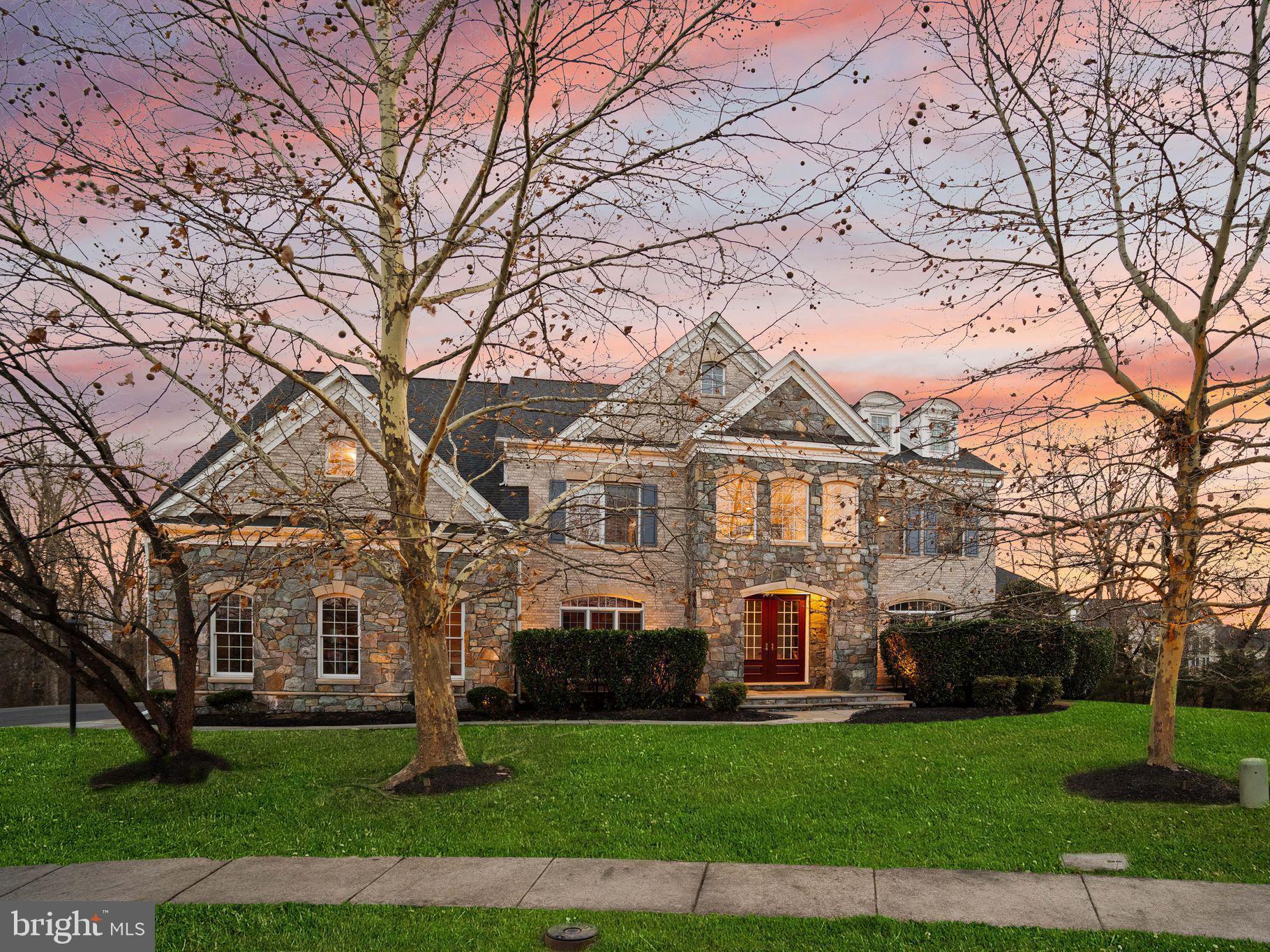 ** Offer Deadline is Monday 12/29 at 11 am.

Discover exceptional outdoor living and elevated interior design in this breathtaking residence, perfectly positioned on a premium lot at the end of a quiet cul-de-sac with no neighbors to your right. Located in the sought-after Loudoun County school district, this home offers unmatched privacy, luxury, and thoughtful upgrades inside and out.  
The main level features two solariums with tray ceilings, two half baths, and an office with French doors and built-in shelving.  The open kitchen boasts Viking appliances, a walk-through pantry, and a convenient butler’s pantry for storage and prep. The two-story family room is a showpiece with a striking coffered ceiling, recessed lighting, and a dramatic two-story wood-burning stone fireplace. Hardwood floors flow across the upper two levels, enhancing the home’s timeless appeal.
Upstairs, the spacious primary bedroom includes a cozy gas fireplace and access to a private covered deck with wooded views. The spa-like primary bath offers a walk-in shower and jacuzzi tub. All upper-level bedrooms feature en-suite bathrooms, and a convenient upper-level laundry room adds ease to daily living.
The walk-out basement is designed for entertaining, offering a full wet bar and a dedicated theater room complete with recliners, projector, and equipment. A spacious workout room features commercial-grade equipment and TV.
Outside you will find a large composite deck with gazebo including a RainEscape system that keeps the finished under-deck area dry and usable year-round, complete with lighting and ceiling fans. Extensive stone hardscaping offers a retaining wall, stone seating, a gas firepit, and a stunning waterfall feature that naturally recycles rainwater! Enjoy the covered grilling area outfitted with granite countertops, fan, and a conveyed built-in grill, cooktop, and cooler.
Many of the systems on the property have also been updated including 2 condensers in recent years as well as the roof 4-6 years ago.
Don't miss out on this rare opportunity in an unbeatable location!