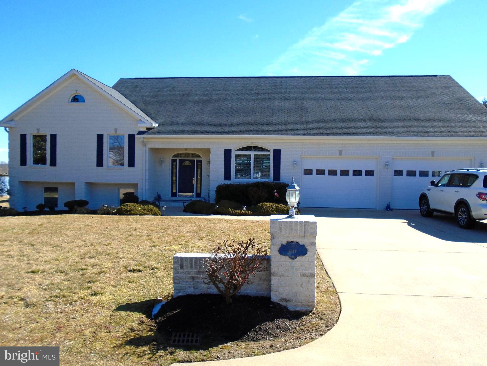 HUGE PRICE DROP!!  Live at the BEACH,* WATERFRONT  ** Very few true WATERFRONT properties in NOVA.  You own 260 feet of bulk headed, navigable waterfront with your own dock.  Two boat lift slips, two jet ski lifts.  Gorgeous Potomac River 180 degree views!  Watch the Moon rise from your luxury soaking tub, or your screened in sun porch or even from your private, enclosed Gazebo.  Or just look out almost any window and see the Moon over the River.  And what better view with your coffee than to watch the Sun come up and light up the River and Sky!  So gorgeous.  Three lots combined into one for just over an ACRE of PRIME WATERFRONT.  One lot could be divided and the Tap Fee has already been paid!  Or use that lot to park your Motor Home or play Pickle Ball on an asphalt pad court.  Has been used for both by current owner.    Did I mention the Brick, Enclosed Gazebo with its own screened sitting area.  Wet Bar and all.  Perfect for those weekly card games or for when entertaining family and friends on your own private beach and pier.  Dock your boat at your backdoor.  Keep your jet skies on their own lifts.  Enjoy the landscaped walks all around the house.  The outside yard and waterfront are worth the price alone.  Now let's look inside!  Talk about curb appeal..  This Blue and White, all brick house has so much to offer!  Concrete Drive and walkways around the house.  Front loading two car garage.  Driveway handles four cars easily plus street side on a quiet neighborhood street.  Crisp, clean lines and this house is unforgettable.  Step into an open Foyer with  Open Floorplan Living in front of you.  You can see the River thru the Wall of Windows as you walk into the house.    Large clean look kitchen to the right with oversized Island for entertaining.  All your friends and family can gather and be apart of the day!  Counter and cabinet space for even the most ardent Chef.    The Living Room has a wall of windows with all those Riverfront views.  Gas fireplace for those cozy cool nights.  Screened Sunroom/Porch  for the Spring, Summer and Fall days and nights.   Keep an eye on your boat at the end of your own dock.    Want a more formal event?  Use your Waterfront Windows in the Formal Dining Room to dazzle your guests!  Early morning coffee, use the casual dining area right off the Kitchen that overlooks it all!  And this is just the Main Floor!  Go upstairs to the Bedroom area.  Two family Bedrooms and Full Bath.  The Owner's suite is out of this world.  Huge windows to look out while you enjoy Breakfast in Bed.  Or watch the Moon come up of the River from you Deep Soaking Tub.  Enjoy a shower in the separate area with even a bidet!  The nautical look really sets the house apart from all the others.  A trip to the Beach everyday!  But wait, there's more!  The lower level just keeps going on and on.  Large Family/Rec Room with Plantation Shutters.  Built in bookcases.  Full of light like the rest of the house.  There is a middle room used for an office with built in counters.  Full bath with shower here also.  Laundry area with wash tub.  Keep moving towards the River and there is another Bedroom currently used as a second office with windows looking out to the backyard and water views.  There is even a separate outside entrance for privacy use of the lower level.  So many options that are endless.  Now let's talk about the basics.  Dual Zone HVAC.  Heat pumps with a Propane Heat option for back up and those colder days when Heat pumps just don't keep you warm.  Oversized garage for storage as well as protecting your cars inside.  Oversized drive for those with lots of cars or guests.  There is not another waterfront house in Prince William with 260 feet of private waterfrontage and private dock.  Located just moments away from the Rippon VRE.  Four miles to Stonebridge and Wegmans.  Five miles to Potomac Mills.  Sentara Hospital, RT 95 and RT 1 all just moments away!